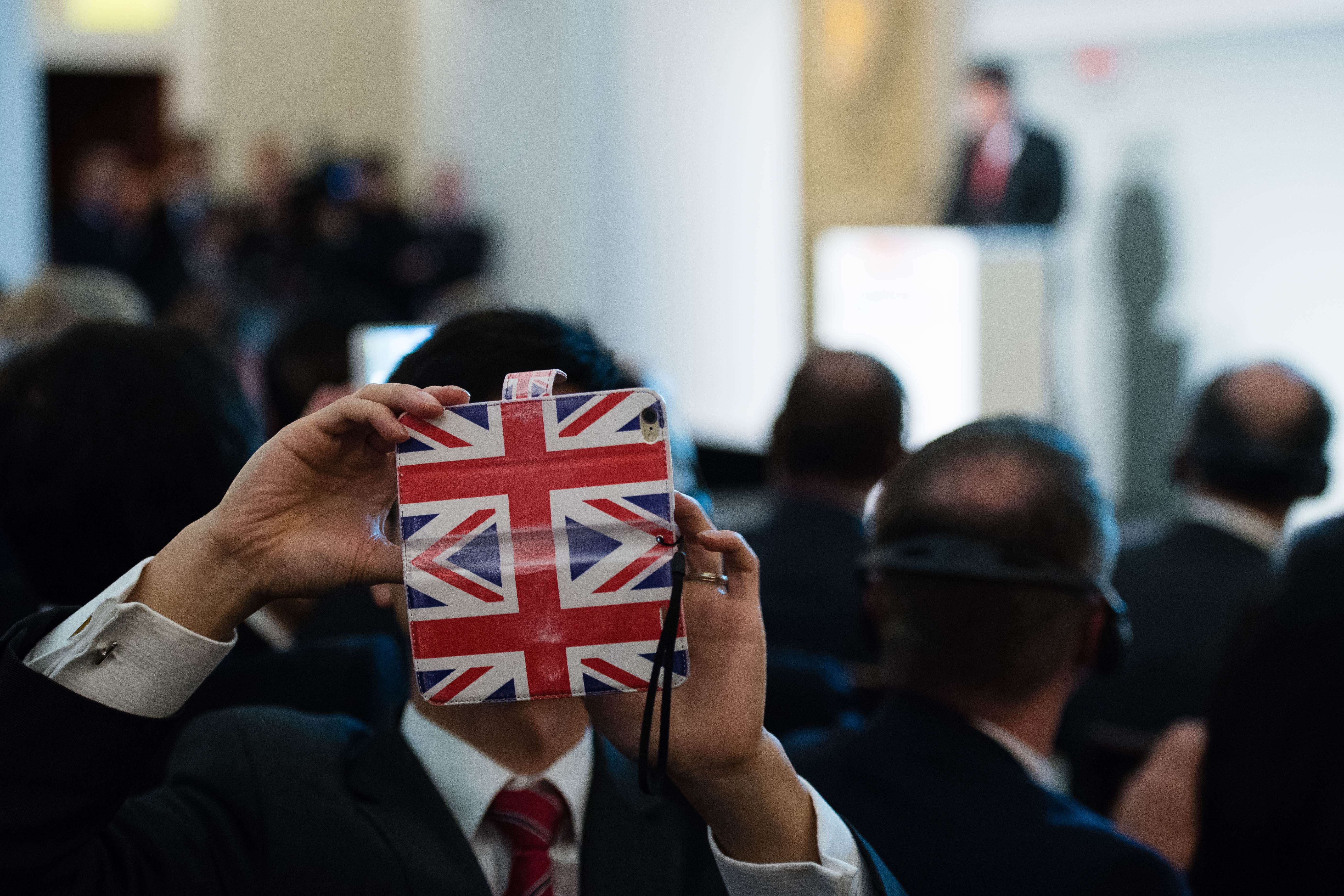 A summit attendee takes a selfie as Chinese President Xi Jinping delivers a speech at the UK-China Business Summit in Mansion House, London, during the state visit in which the Hinkley Point nuclear deal was agreed. Photo: AFP