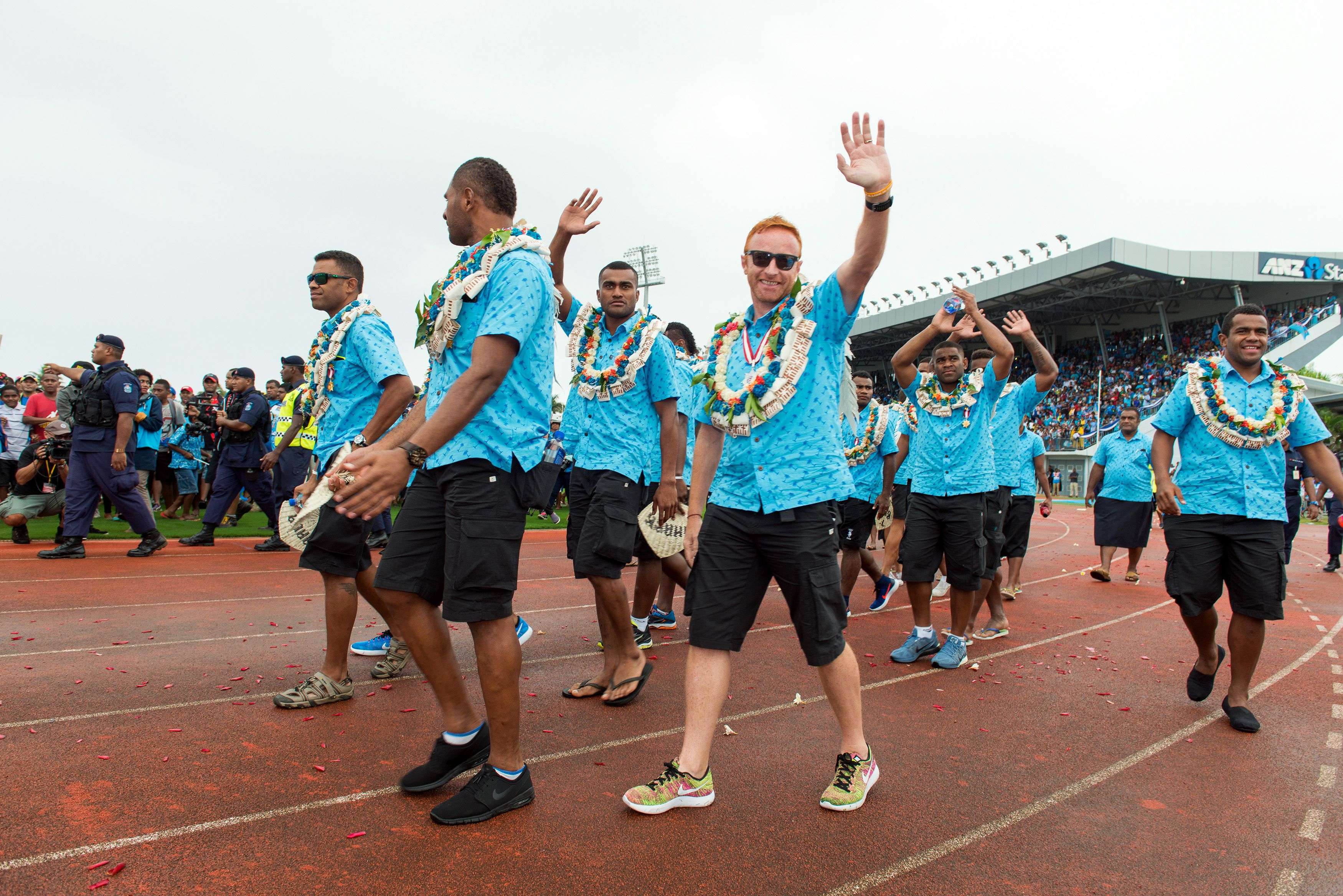 Fiji's rugby sevens coach Ben Ryan waving to the crowd during a victory ceremony. Photo: AFP