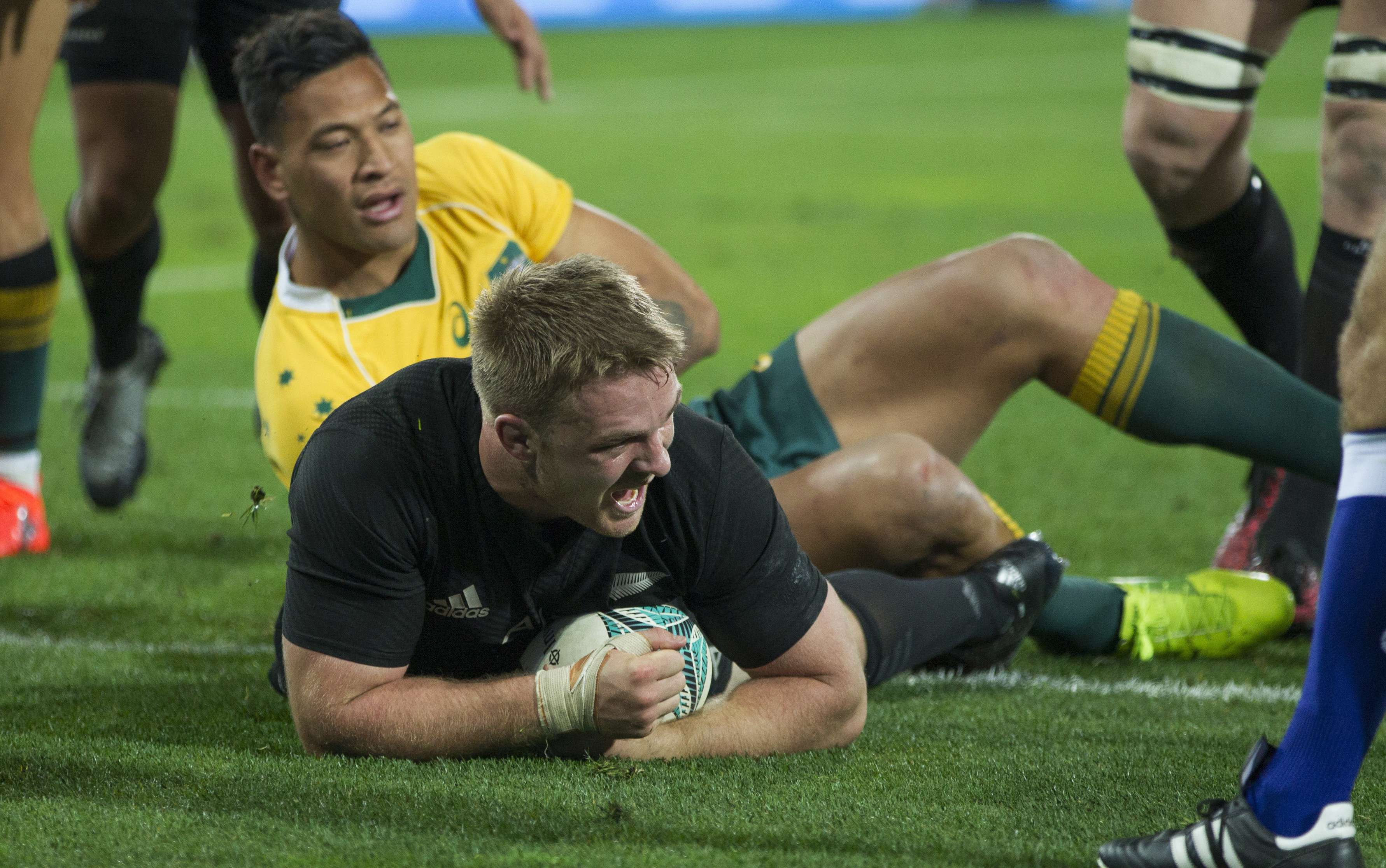 All Blacks flanker Sam Cane scores a try as New Zealand defeat an Australian side he says lacked focus. Photo: AP