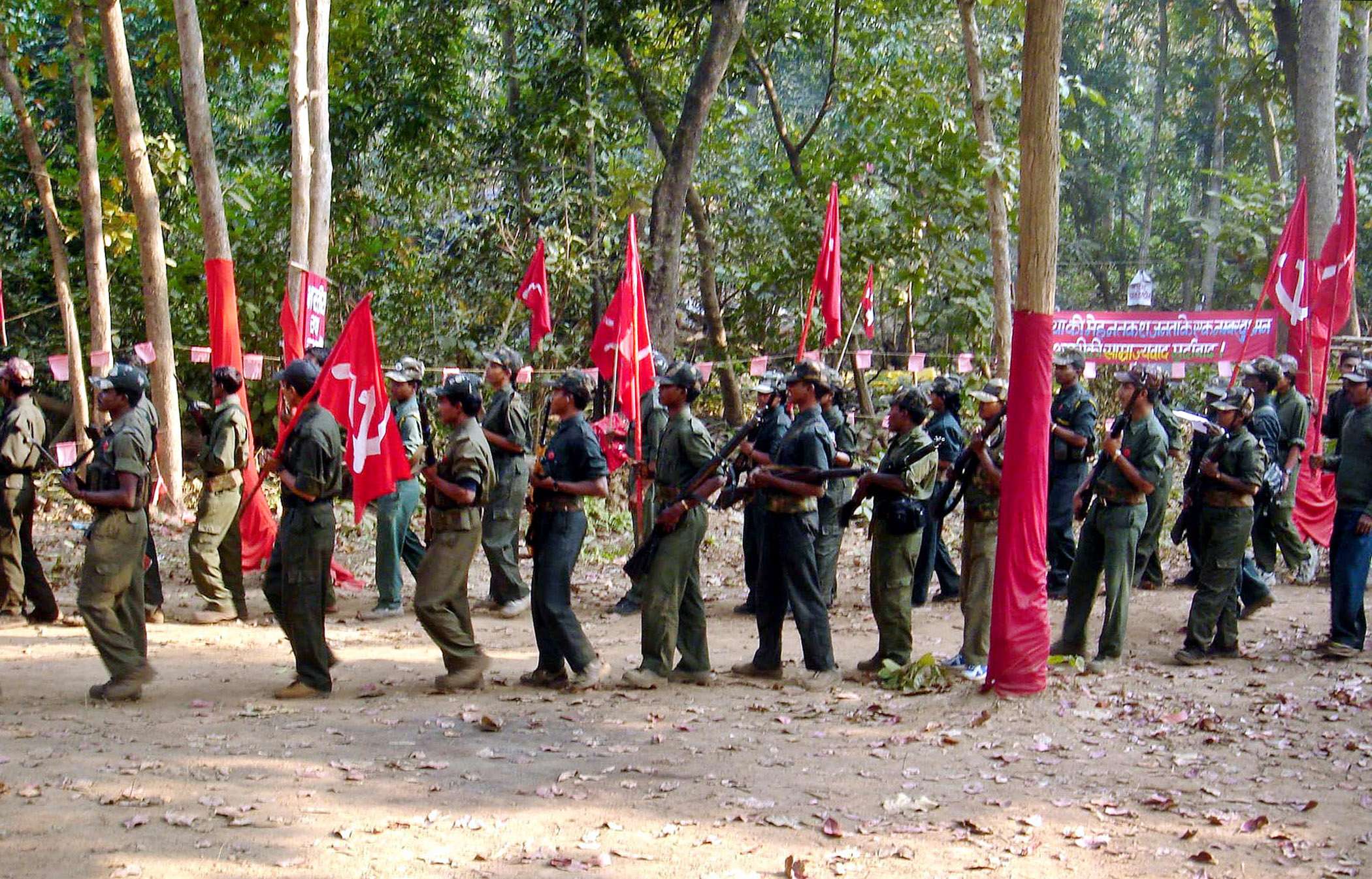 Maoist rebels march in the jungles of the Indian state of Chhatisgarh, 1,500km southeast of New Delhi. The rebels, who claim to be inspired by Chinese revolutionary Mao Zedong, have been fighting in several Indian states, demanding land and jobs for agricultural labourers and the poor. Photo: AP