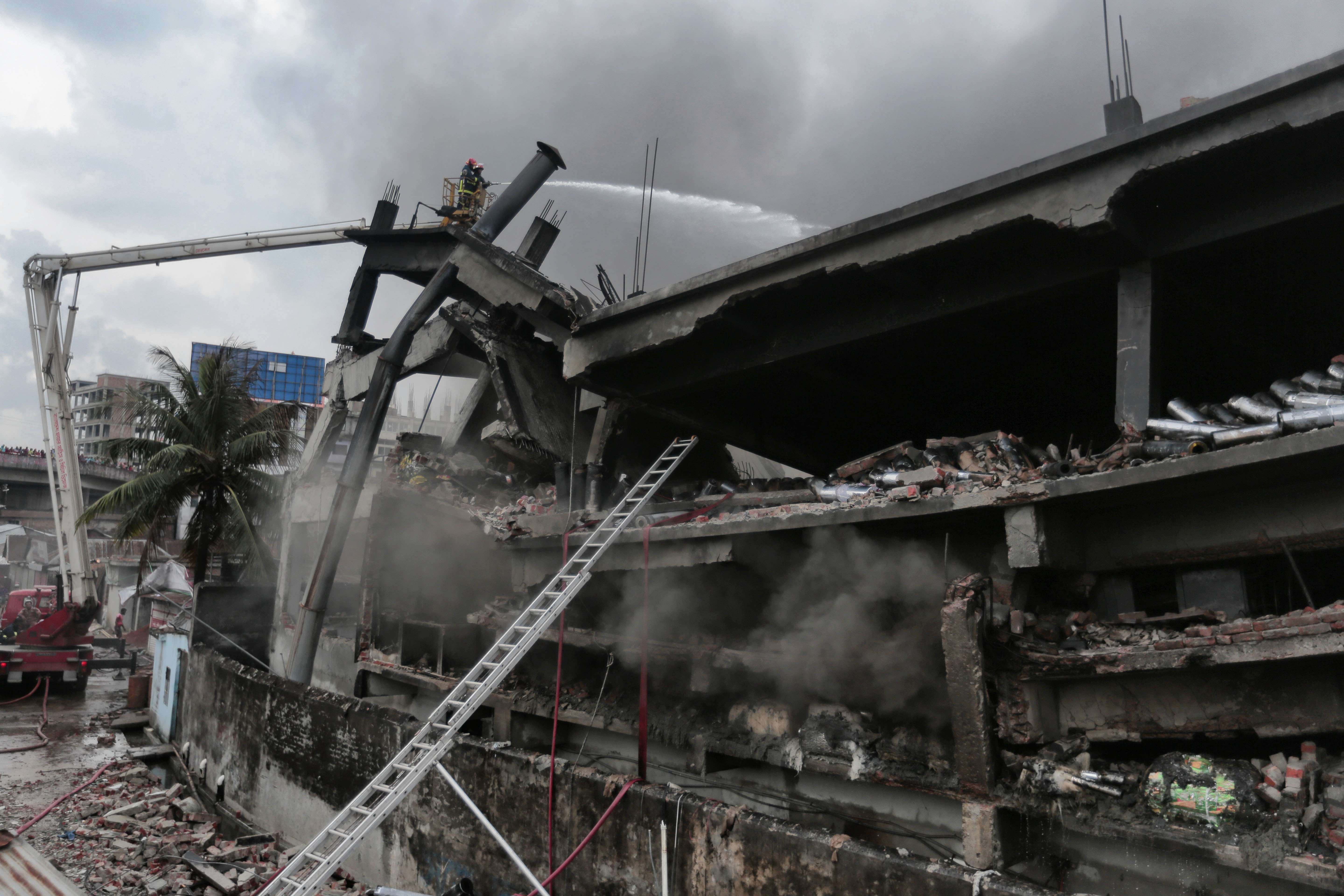 Firefighters work to put out a fire at Tampaco Foils factory in Tongi. Photo: AP