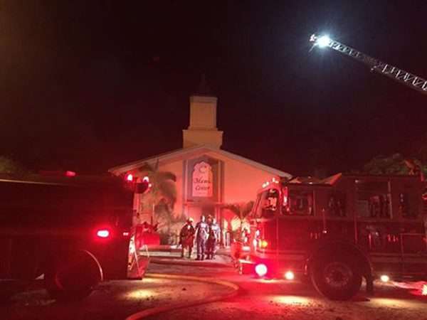 A handout photo provided by the St Lucie County Sheriff's Office on Monday shows firefighters and police responding to a fire at the Islamic Centre in Fort Pierce, Florida. Photo: EPA