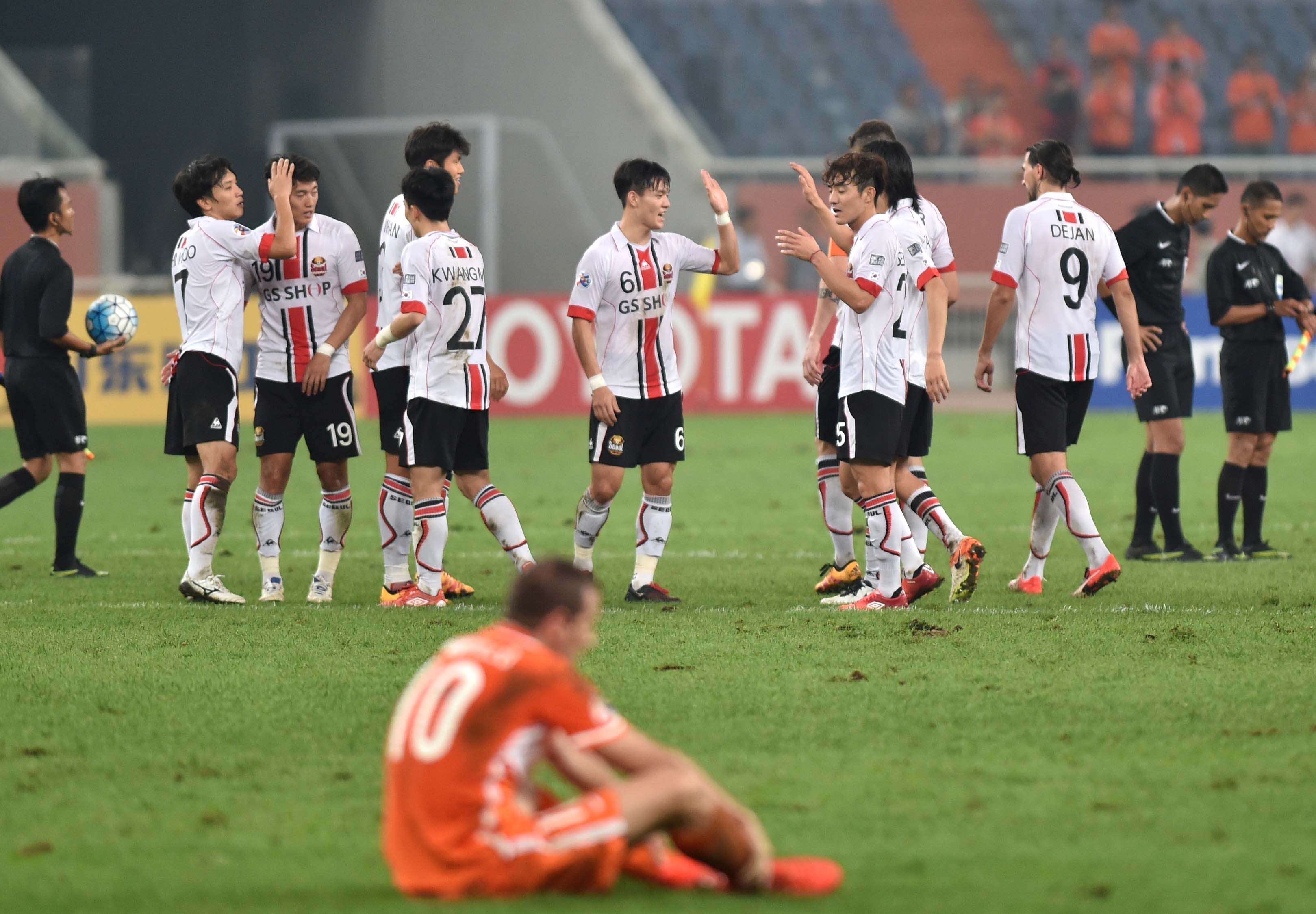 FC Seoul players celebrate after beating China’s Shangdong Luneng in Jinan. Photo: Xinhua
