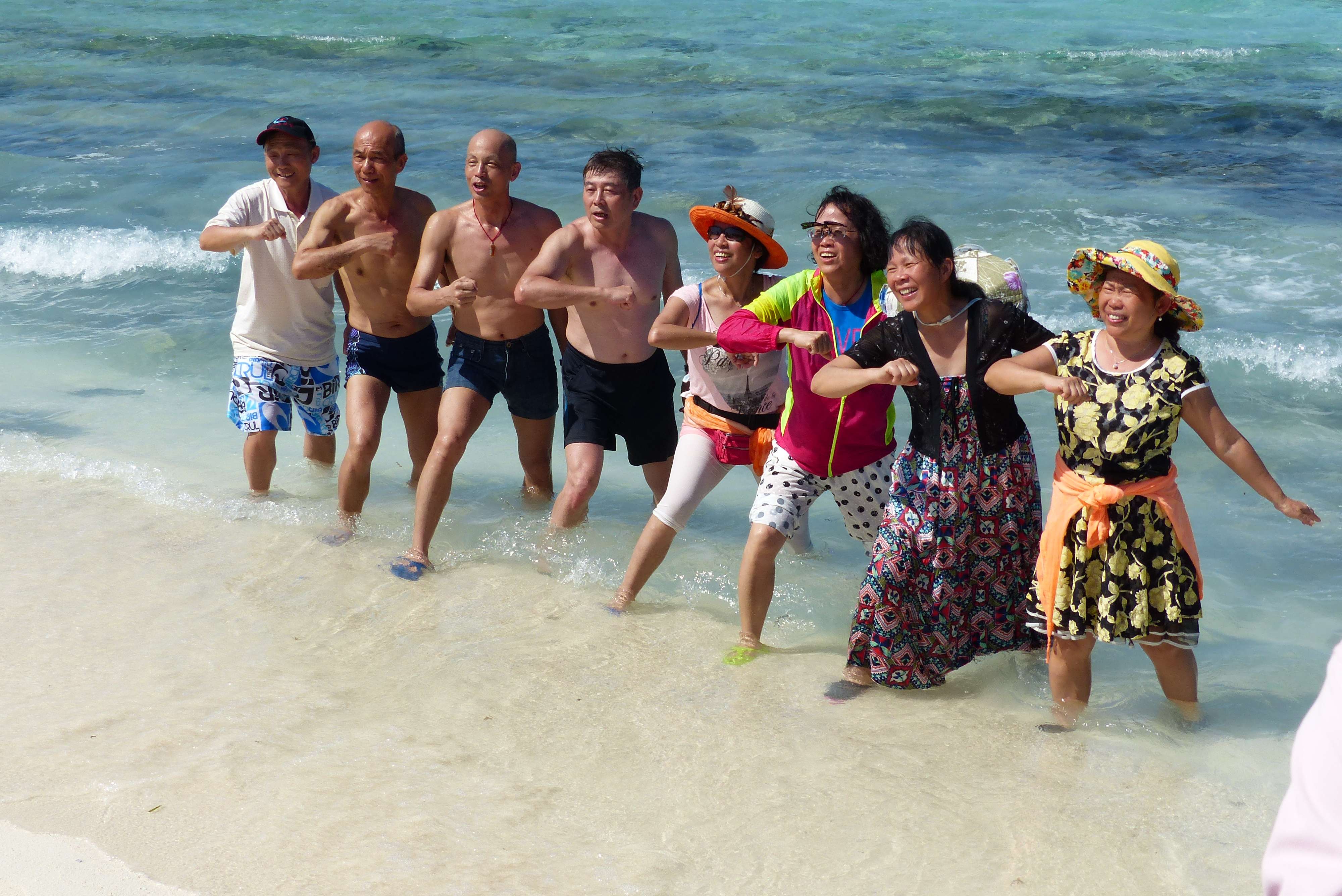 Chinese tourists sing and dance to patriotic songs on Silver Islet in the Paracel Islands. Photo: SCMP Pictures
