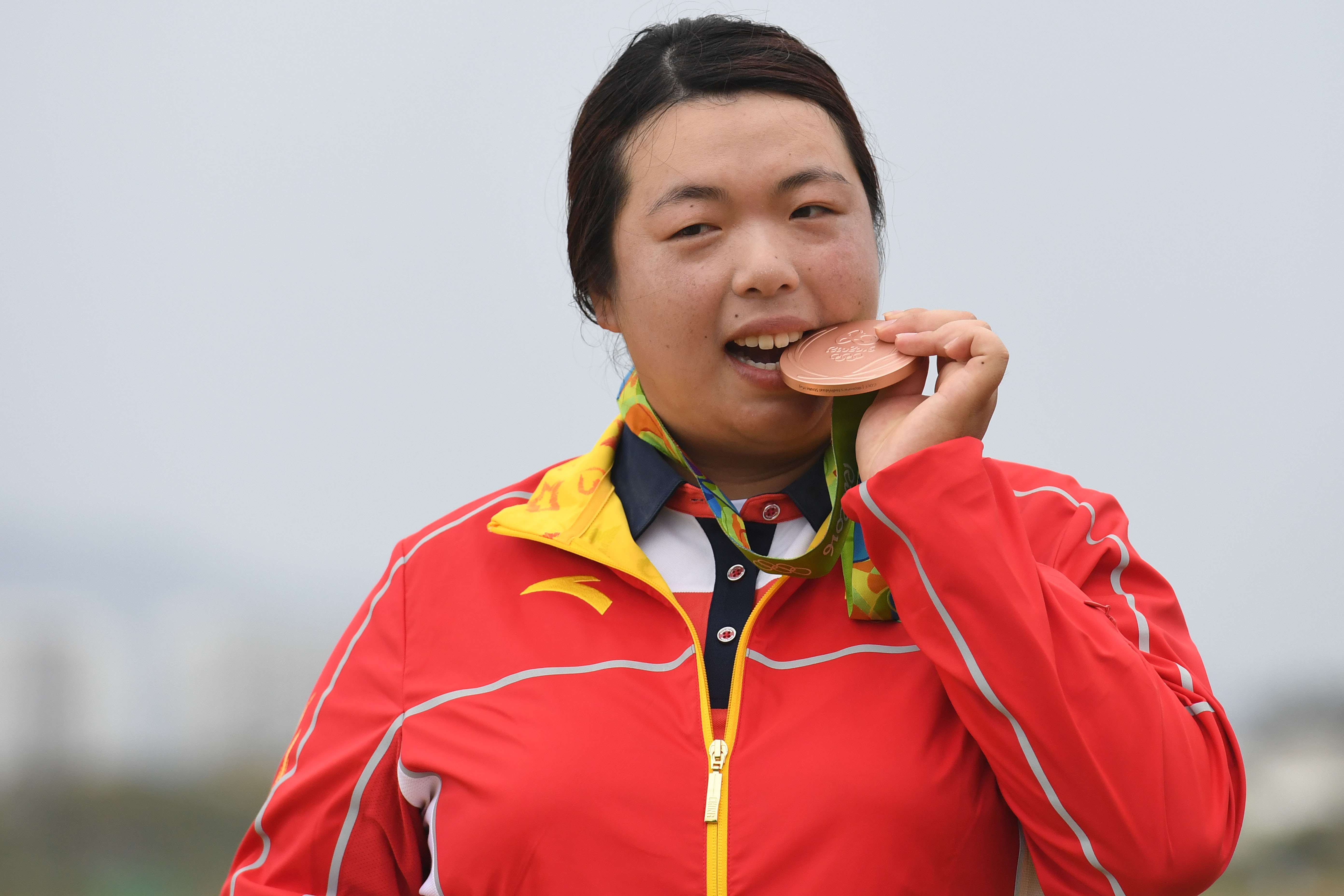 China's Feng Shanshan poses with her bronze medal at the Olympic Games. Photo: AFP