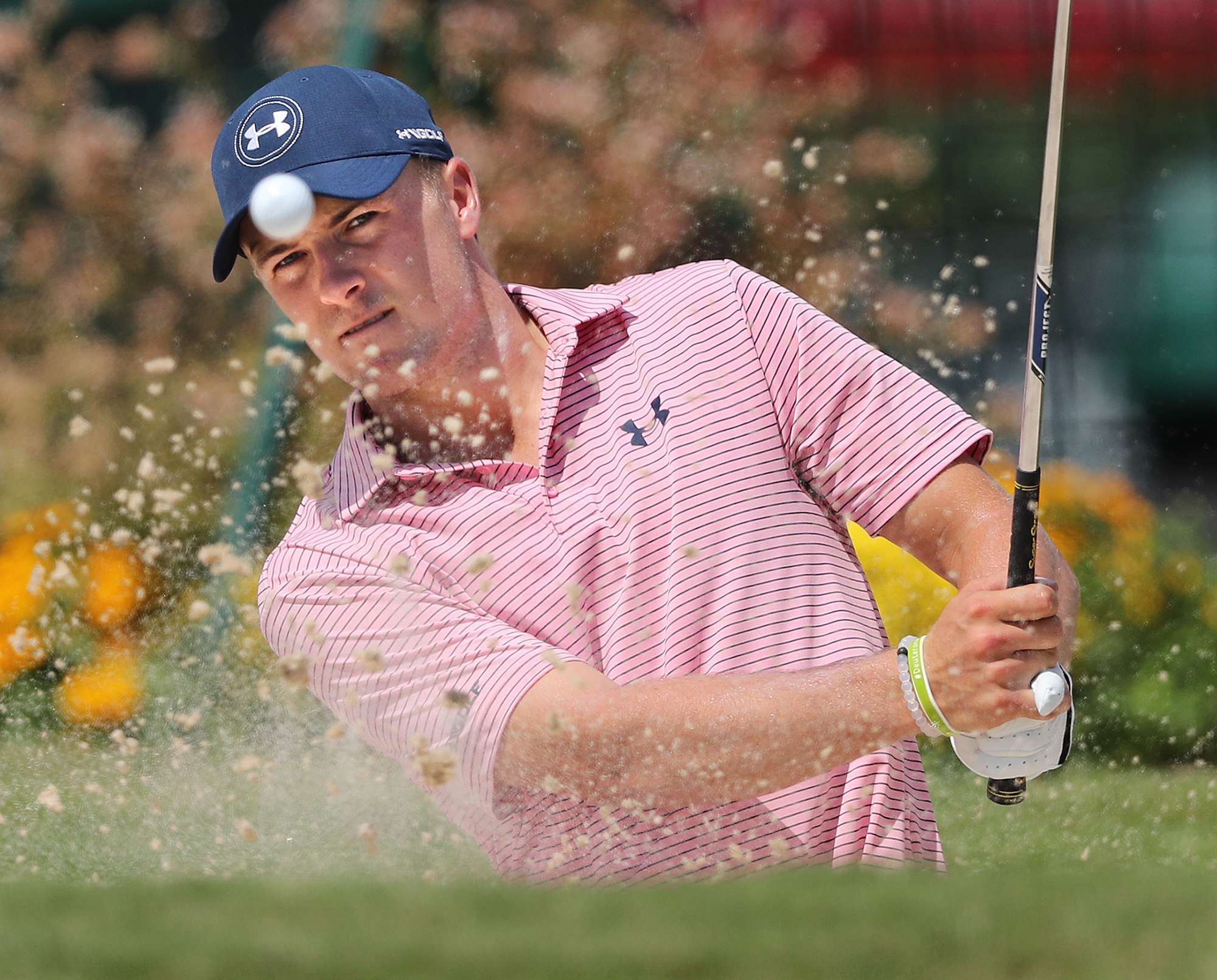 Jordan Spieth hits sand shots to the practice green while preparing to defend his Tour Championship title at East Lake Golf Club in Atlanta on Tuesday. Photo: AP