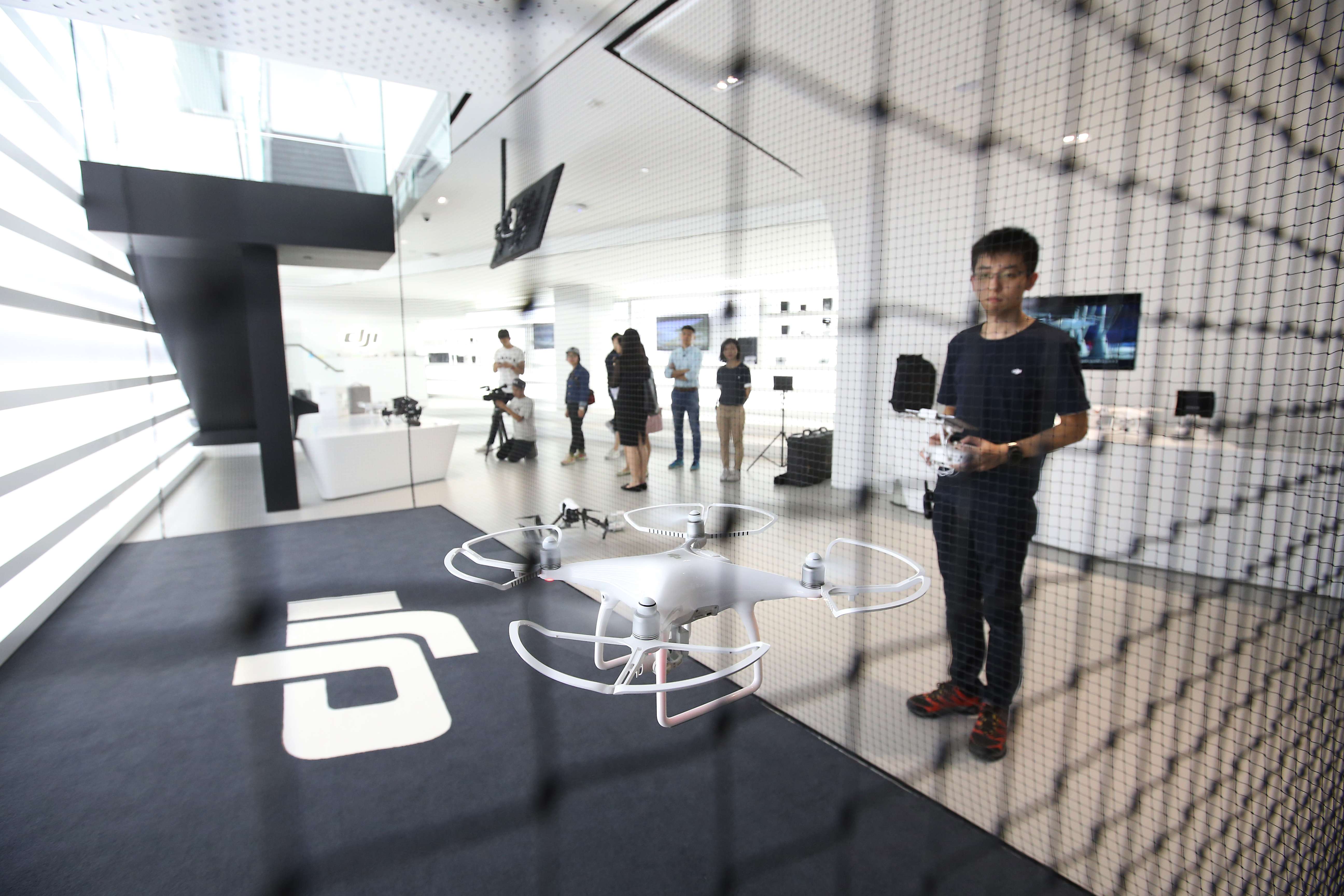DJI’s new store in Causeway Bay will allow customers hands-on experience of flying the drones inside a caged area. Photo: Dickson Lee