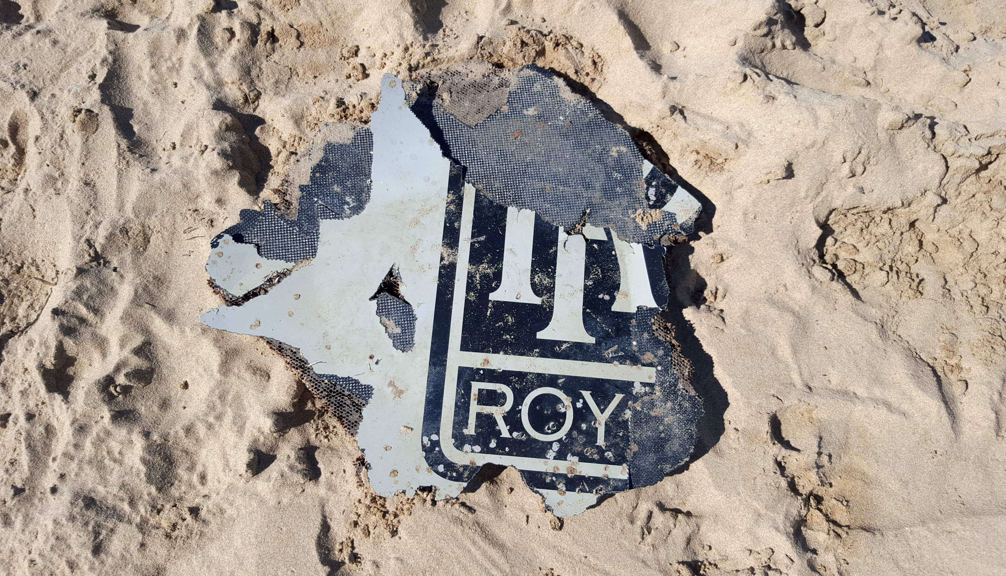 A piece of suspected aircraft wreckage found off the east African coast of Mozambique earlier this year. Australian authorities have confirmed the recovery of another piece of wing flap from the missing Malaysia Airlines Flight 370. Photo: AFP / Neels Kruger