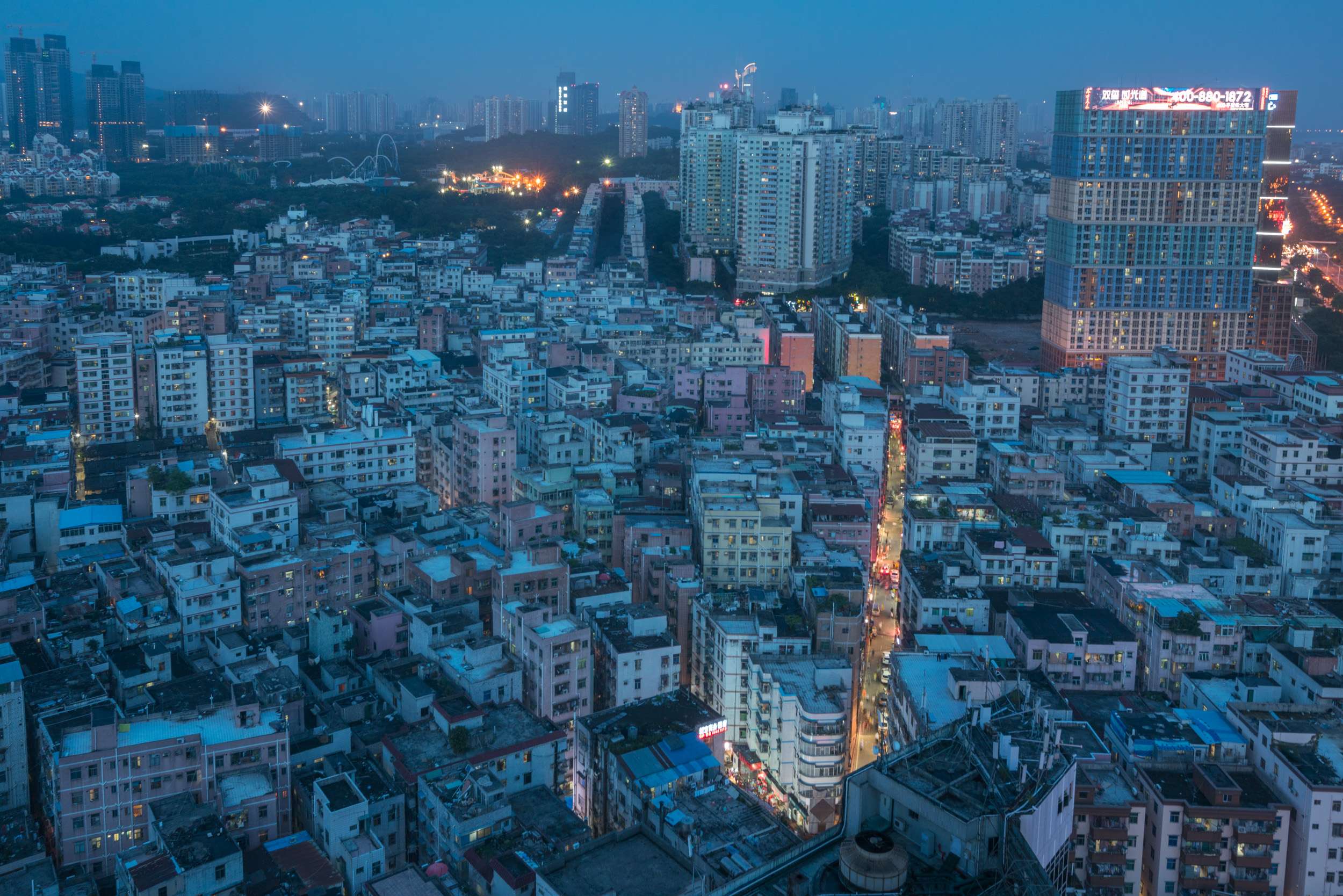 Baishizhou’s frenzied commercial streets light up the night in the heart of Shenzhen’s swankiest district. Pictures: Theodore Kaye