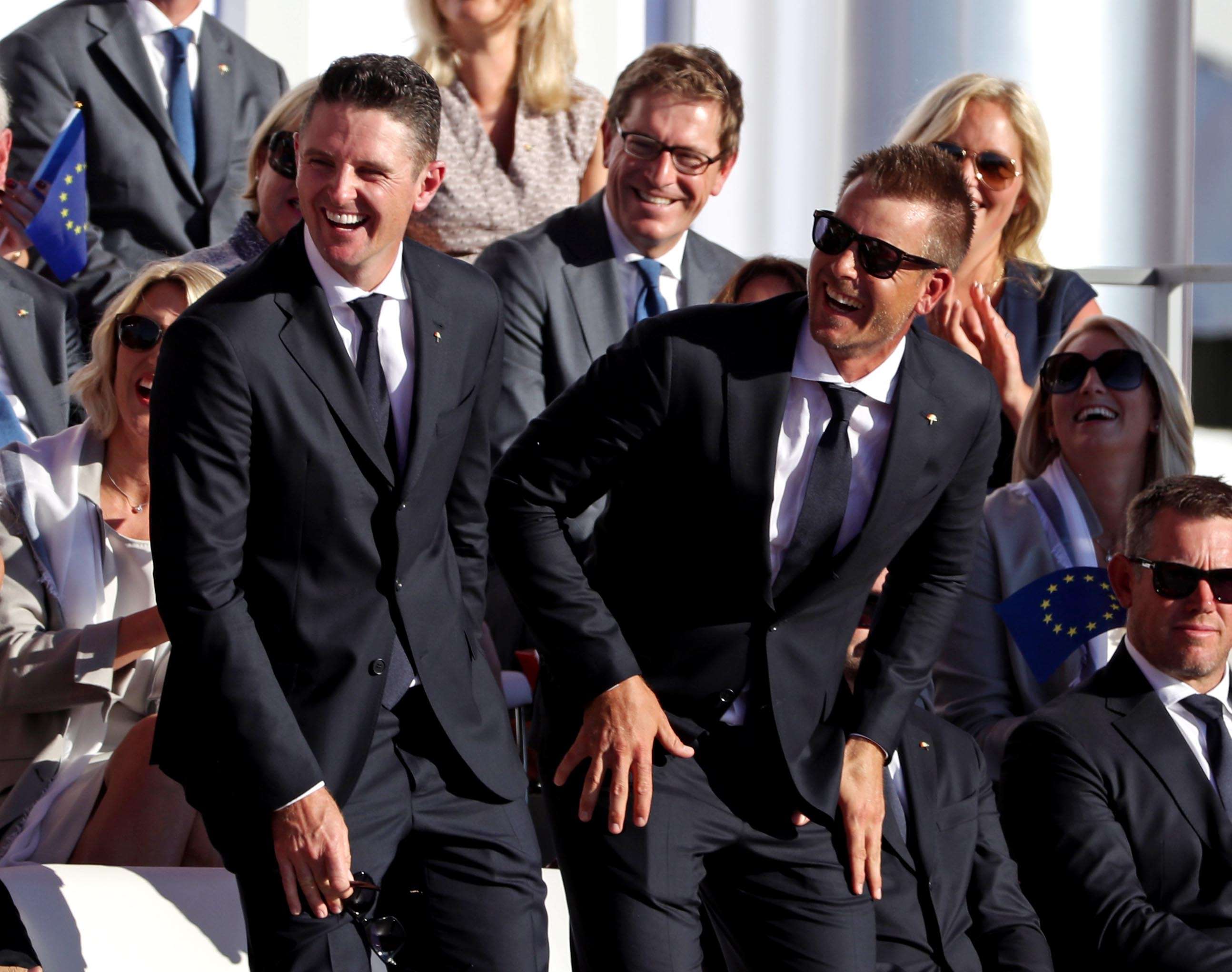Justin Rose of England and Henrik Stenson of Sweden laugh during the Opening Ceremony for the 41st Ryder Cup. They have been paired together as Europe’s strongest two. Photo: USA Today