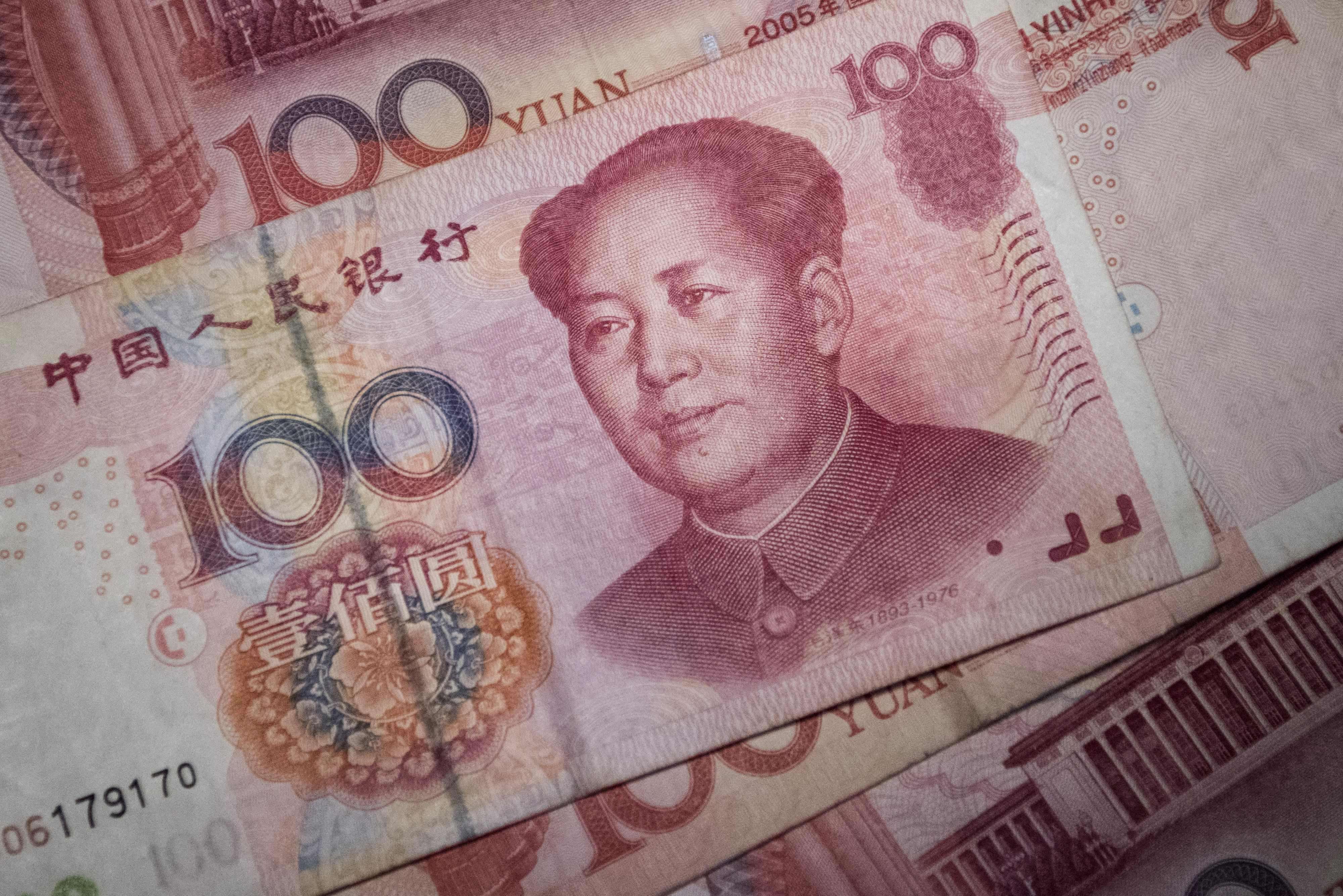 China's yuan was included in the International Monetary Fund's elite SDR basket of currencies on Saturday, raising Beijing's banknotes to the status of a global reserve asset. Photo: AFP
