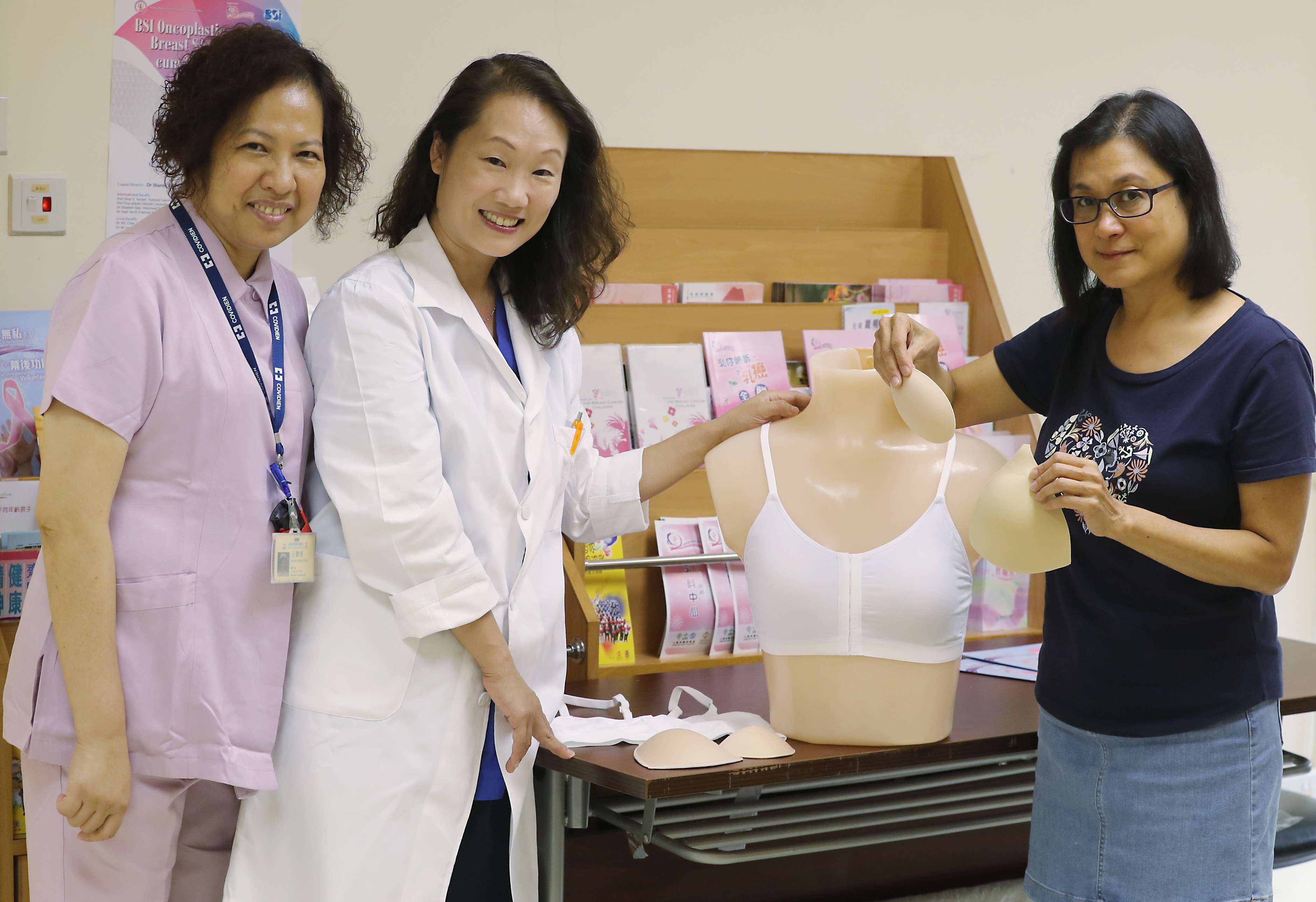 From left: KEC Breast Centre Clinical Director & Consultant Surgeon Dr Sharon Wong Wing-waiDr Chan, breast cancer survivor Emily Ng, and nurse Wong Kwai-ying at the United Christian Hospital in Kwun Tong with the bra which Ng has designed. 30SEP16 SCMP/ Photo: Edward Wong