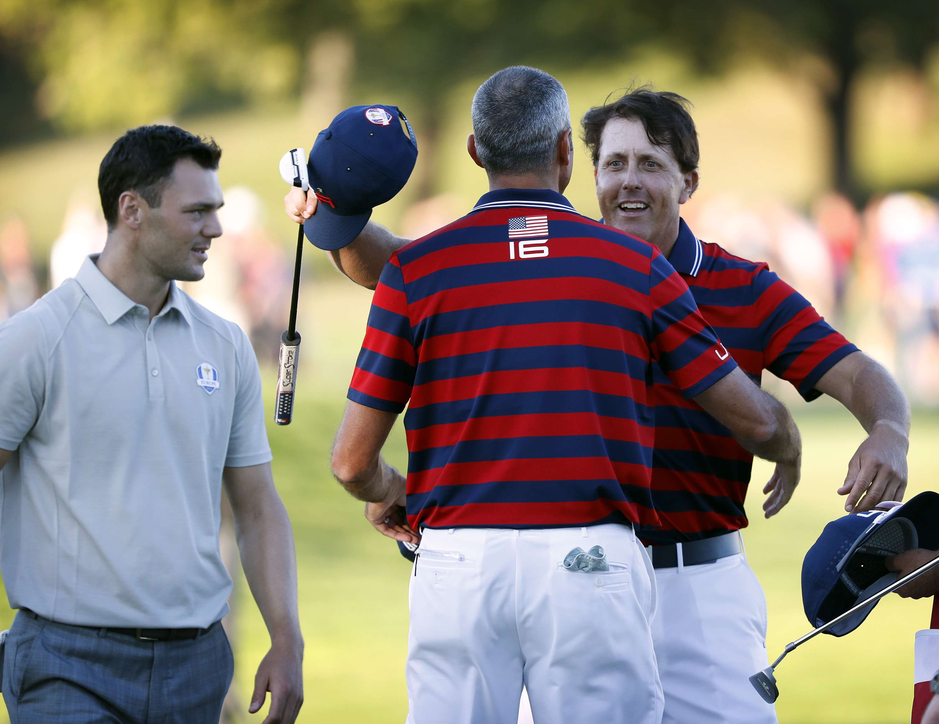 Phil Mickelson celebrates his putt at 17 as the US take a grip on the 2016 Ryder Cup. Photo: TNS