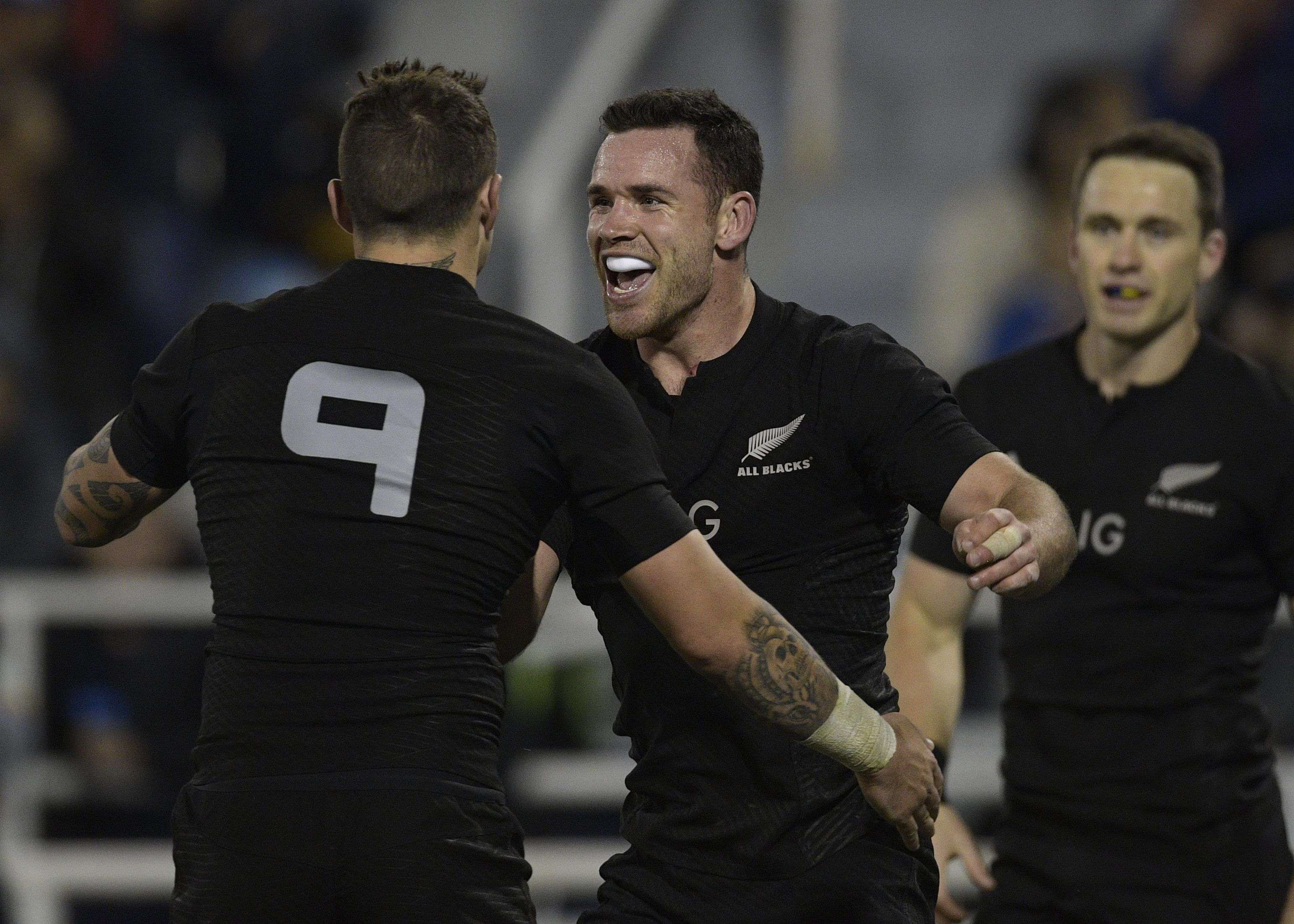 New Zealand centre Ryan Crotty celebrates with team-mate TJ Perenara. Photos: AFP