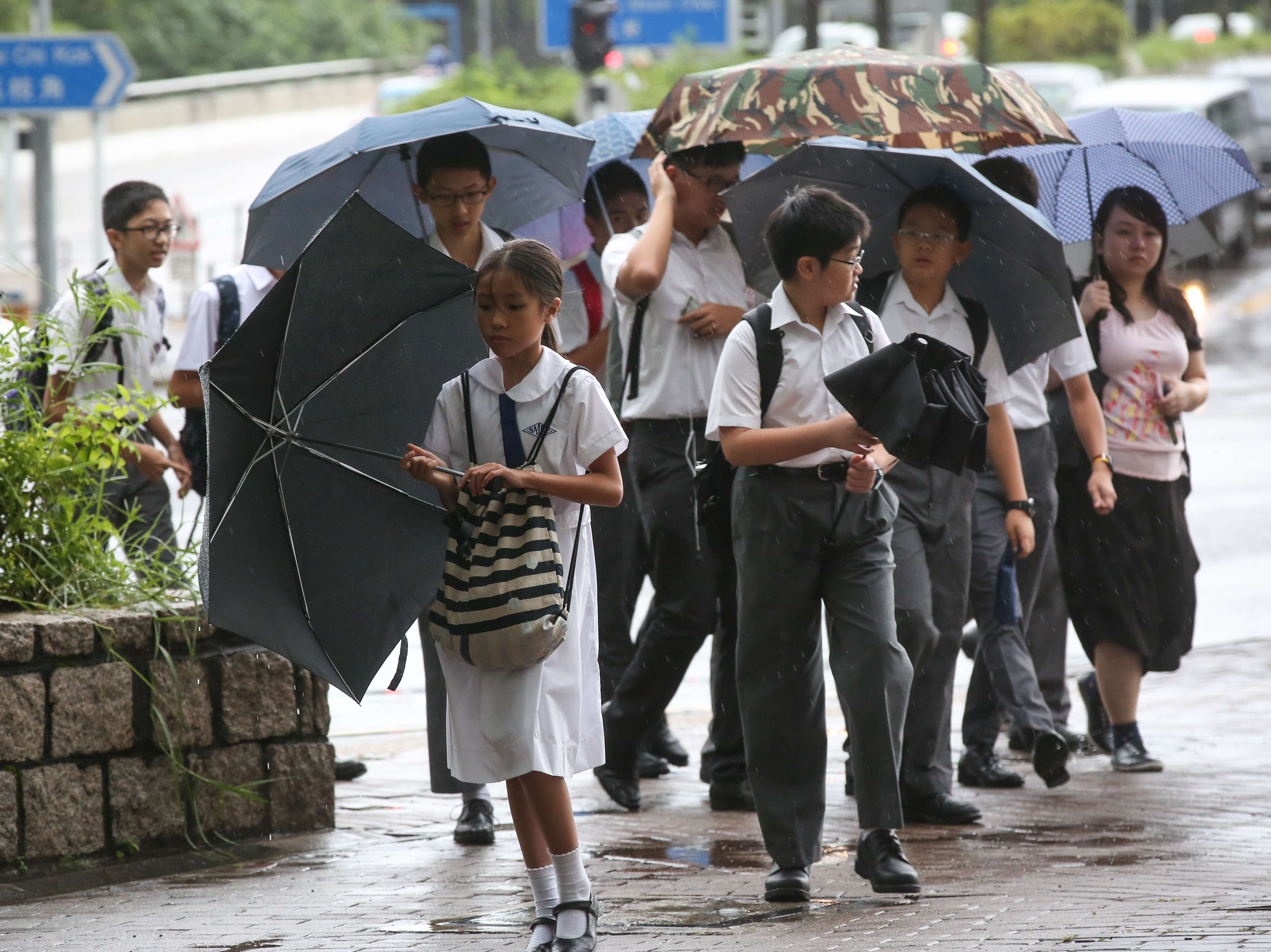Students in Sham Shui Po make their way to school on the first day of a new term this year. Photo: Edward Wong