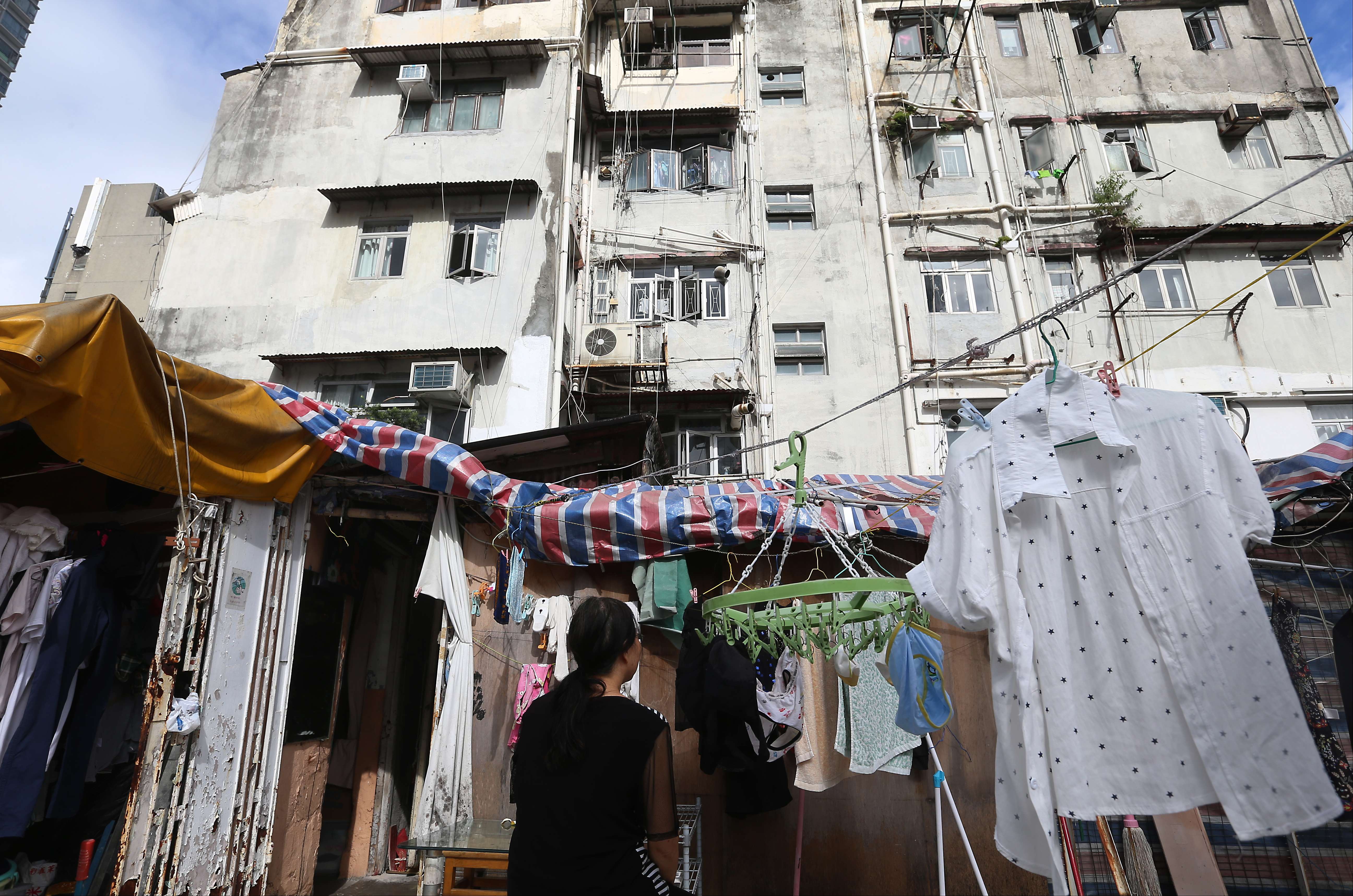 Thousands live in illegal subdivided residential units, yet those on rooftops are particularly vulnerable to eviction because of their visibility