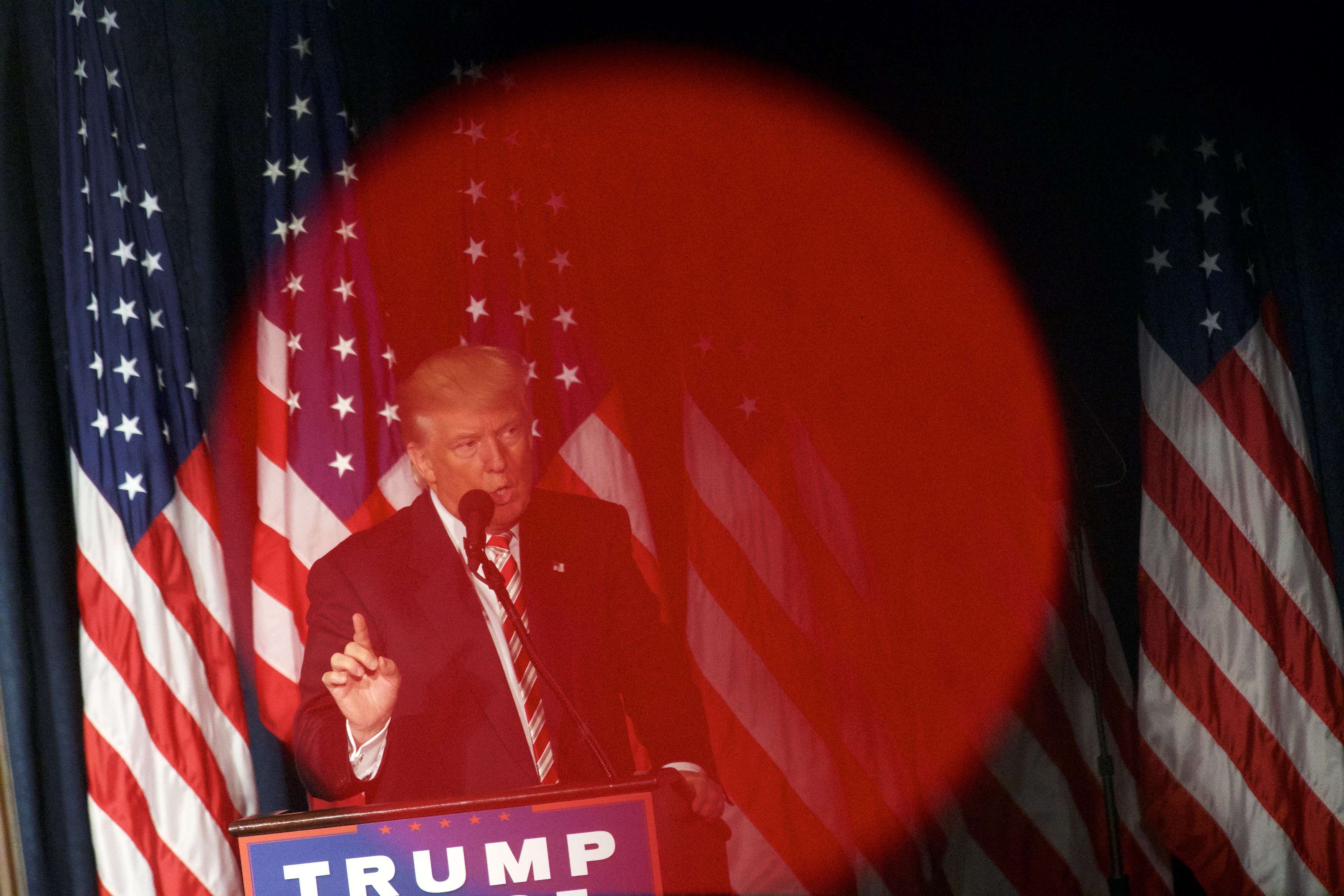 Republican presidential nominee Donald Trump is seen through the red light of a videographer's camera while delivering a speech at The Union League of Philadelphia. Photo: AFP