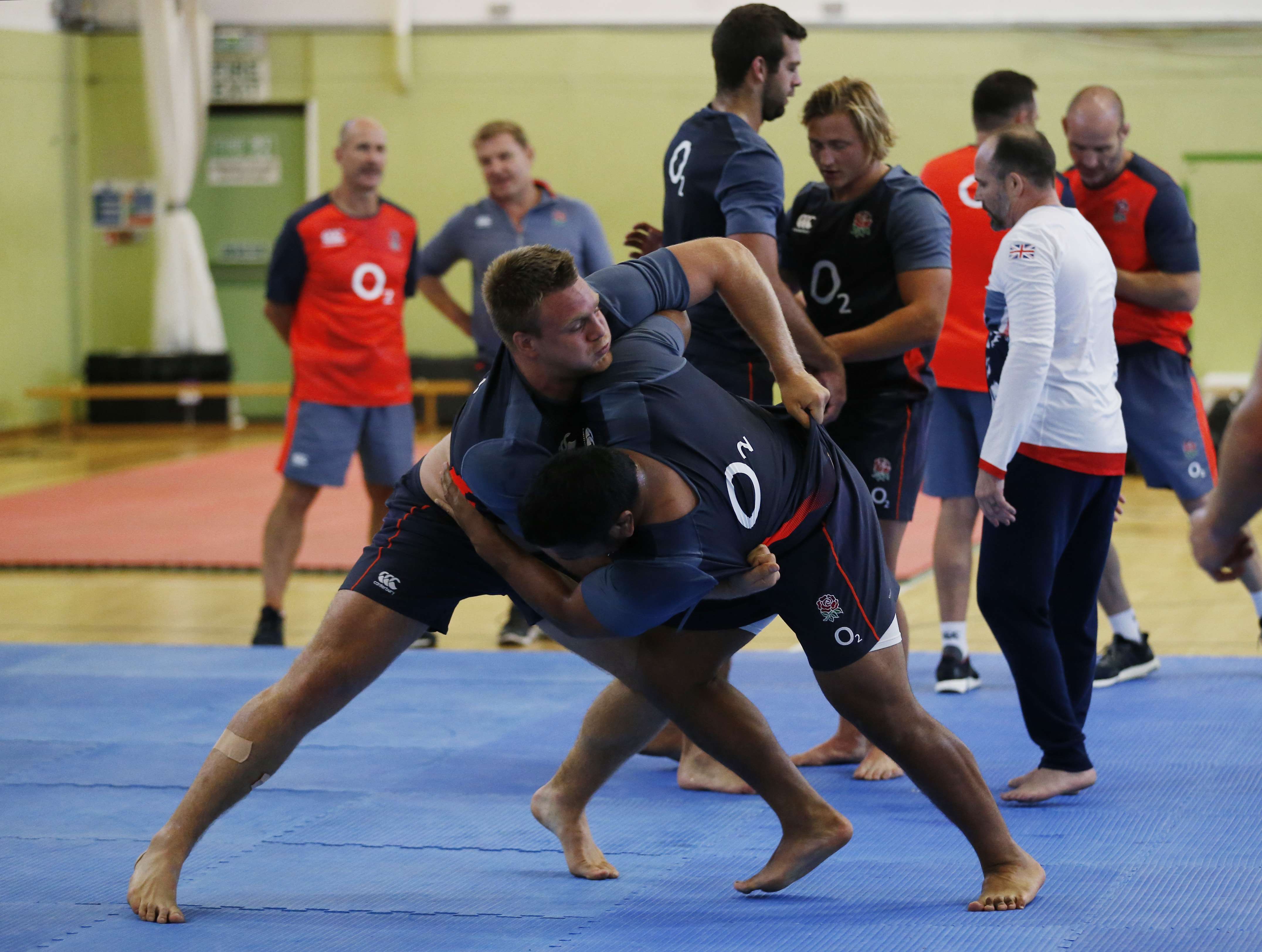 England's Teimana Harrison and Mako Vunipola grapple during the judo session that has seen Eddie Jones come under fire. Photos: Reuters