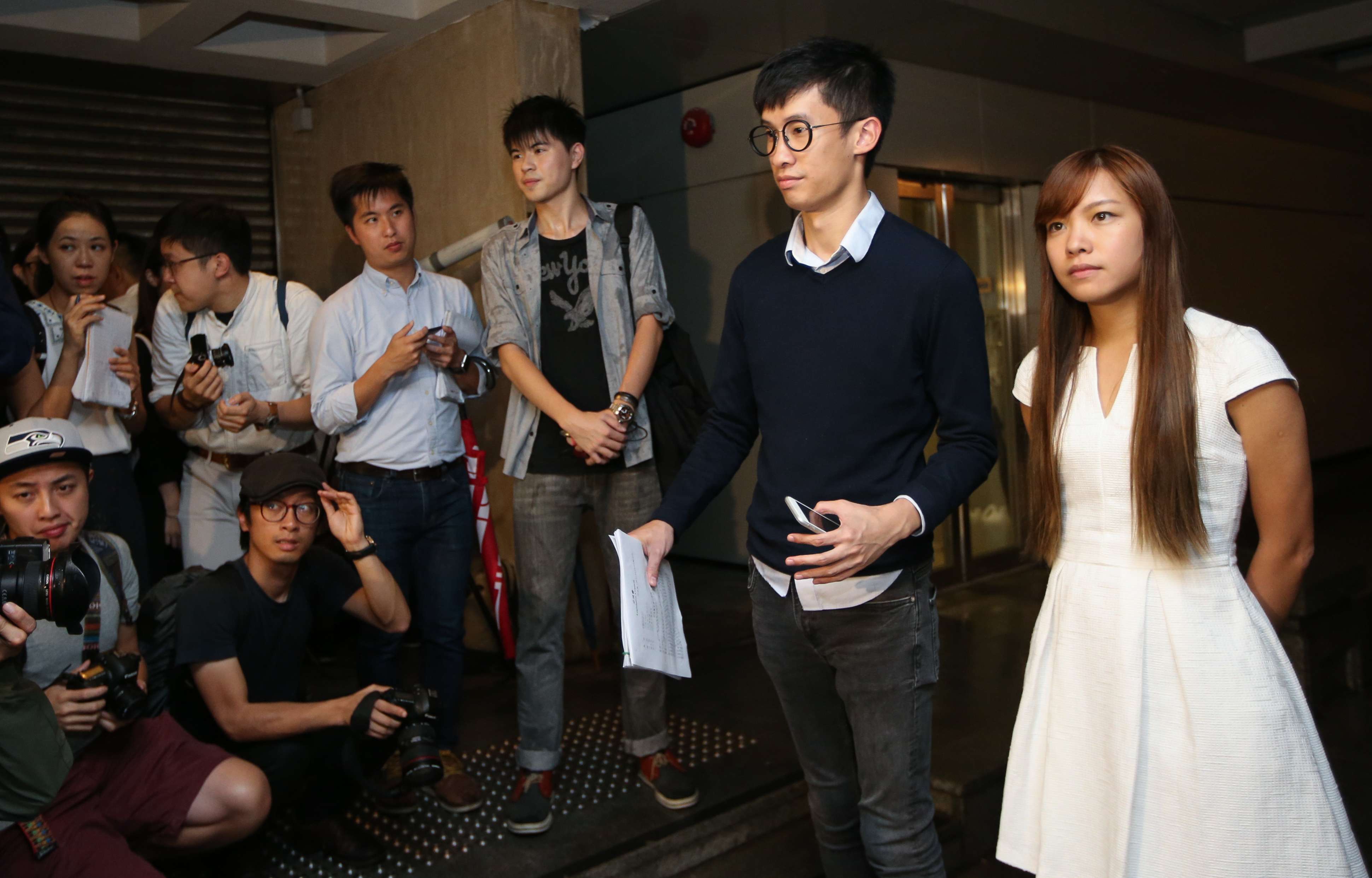 Sixtus Leung and Yau Wai-ching of Youngspiration meet the media outside the High Court. Photo: David Wong