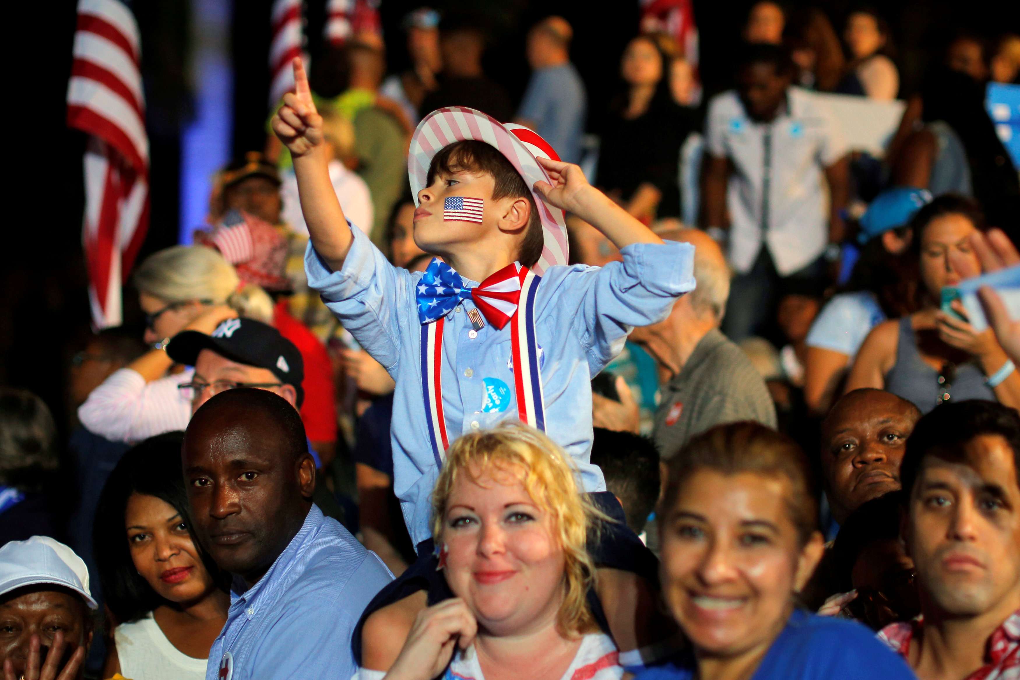 Supporters of presidential candidate Hillary Clinton wait to hear her speak at a rally in Fort Lauderdale, Florida. Photo: Reuters