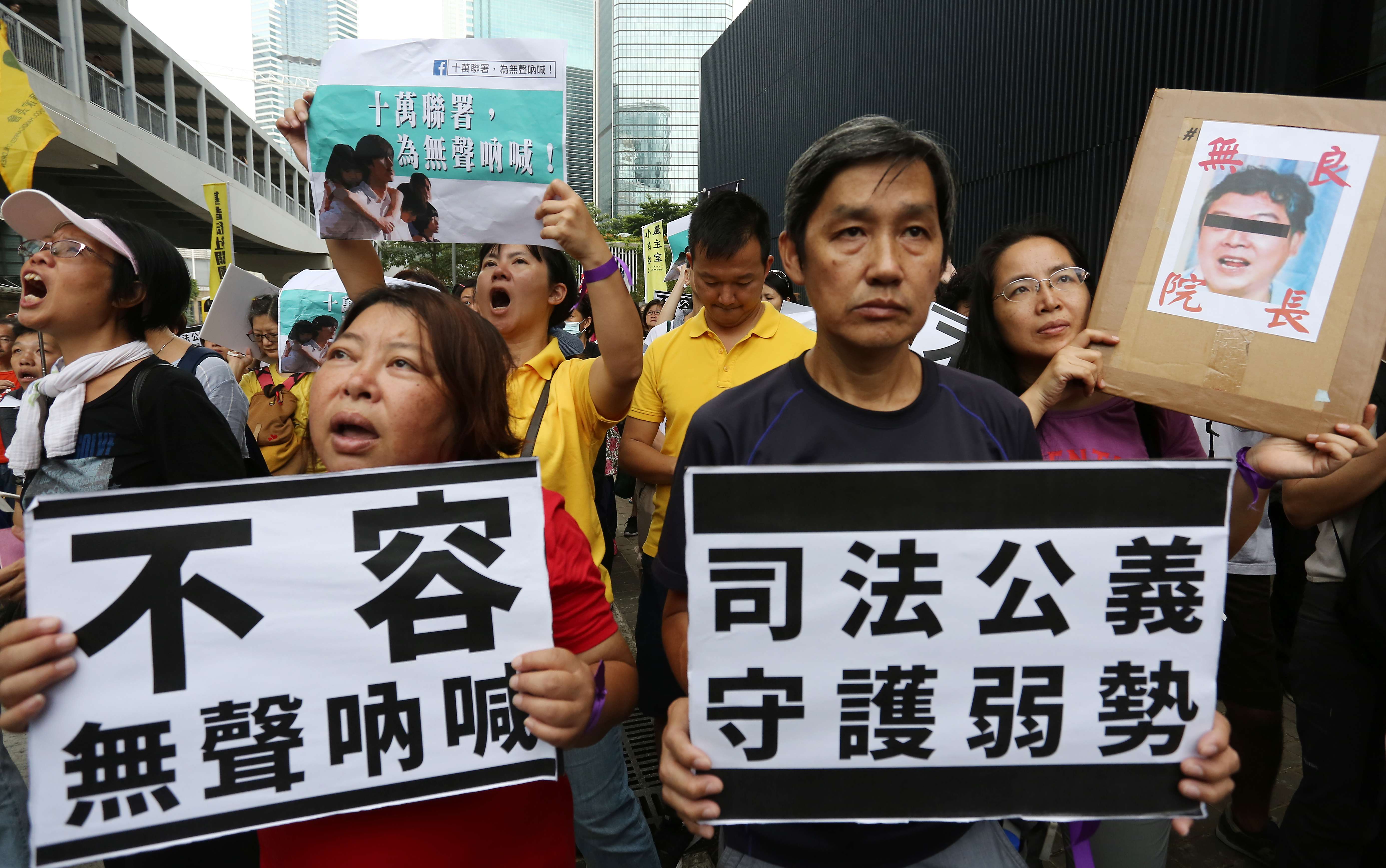 Concern groups march in protest at a decision to drop charges against the former head of the Bridge of Rehabilitation care home in Kwai Chung. Photo: Jonathan Wong