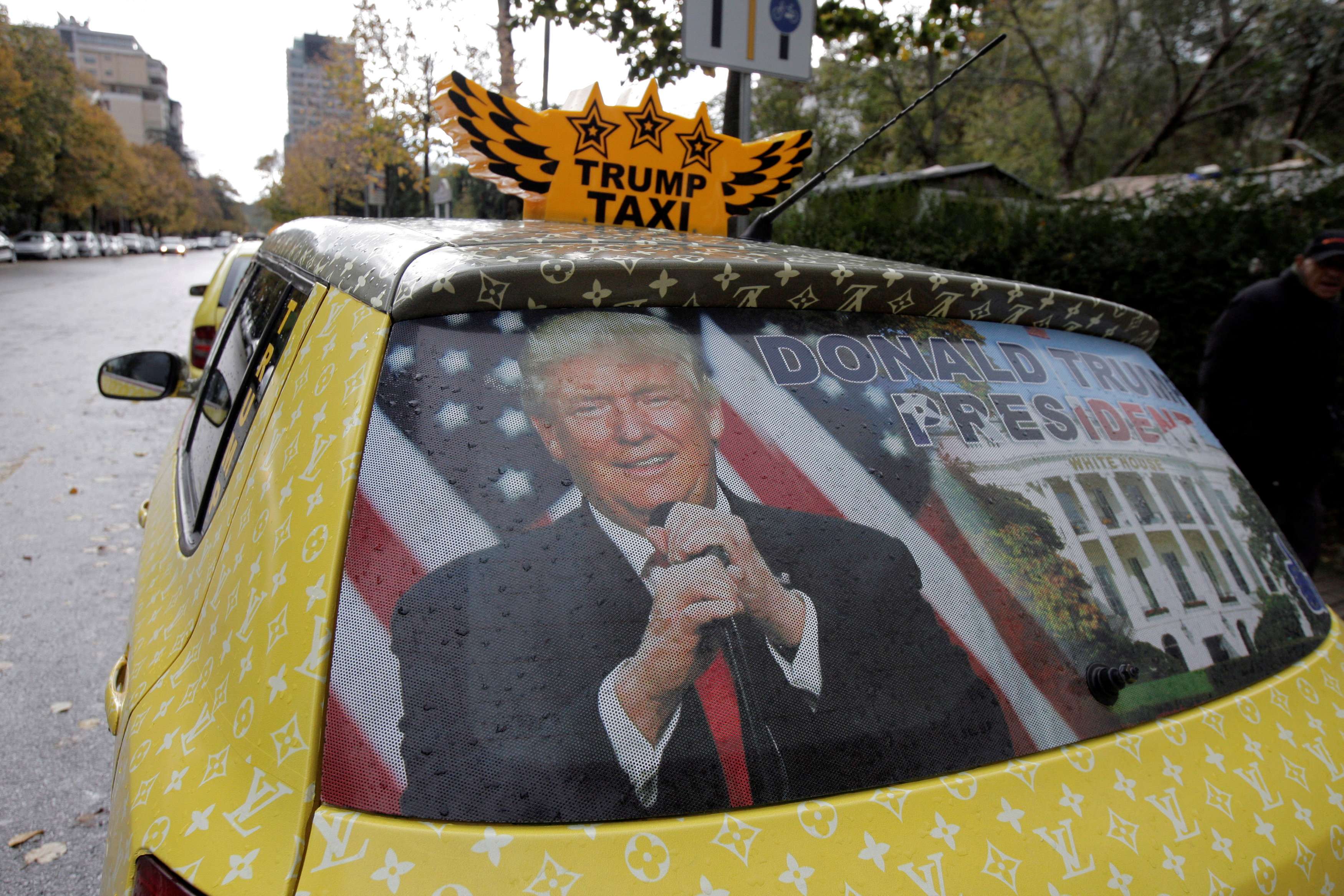 A taxi in Tirana, Albania, is decorated with a picture of Donald Trump to celebrate his victory in the US election. Those who have been accused of elitist arrogance need to at least try to see things from their accusers’ point of view. Photo: Reuters