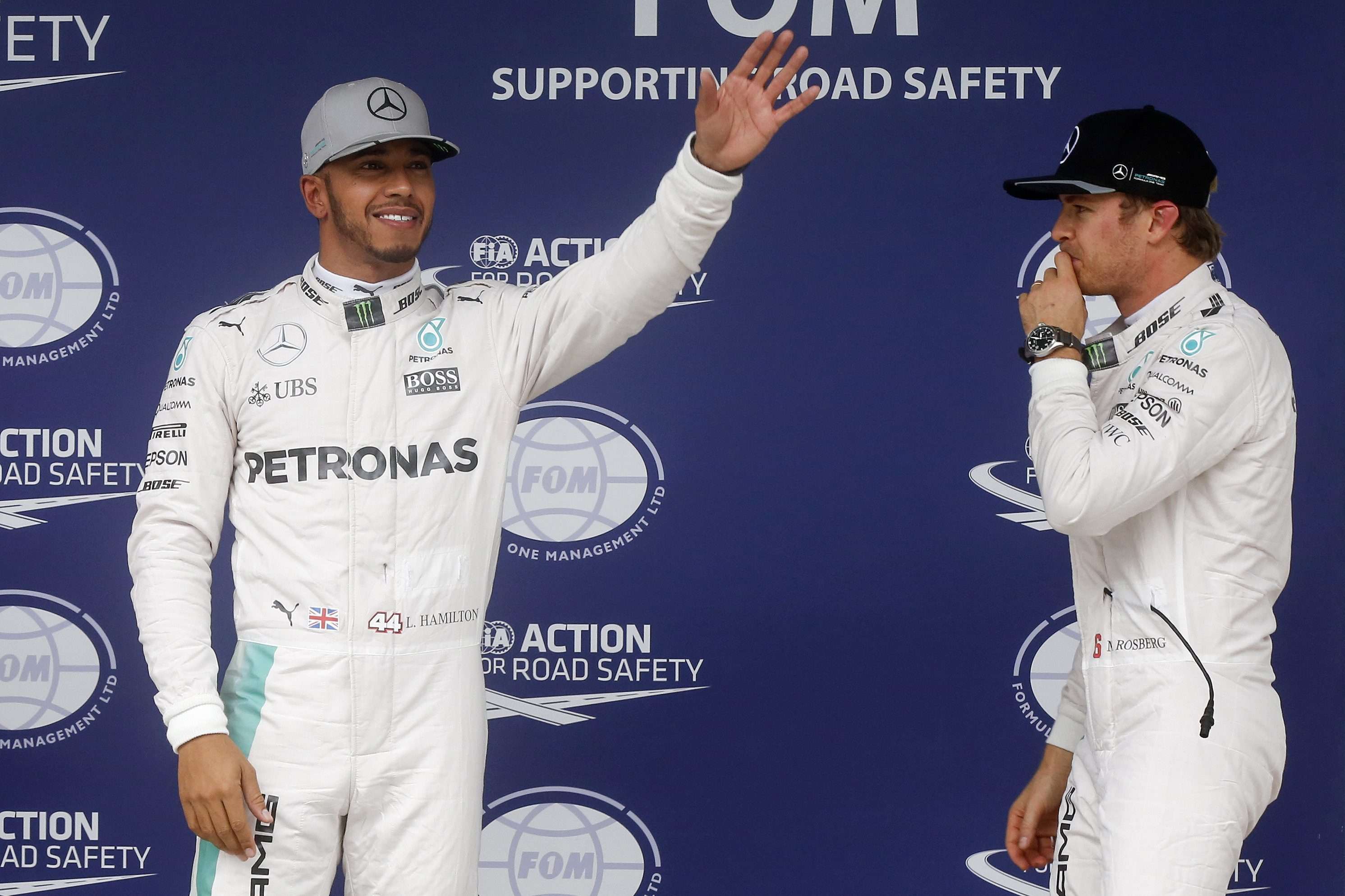 Britain’s Lewis Hamilton and German Nico Rosberg of Mercedes team on the podium after qualifying. Photo: EPA