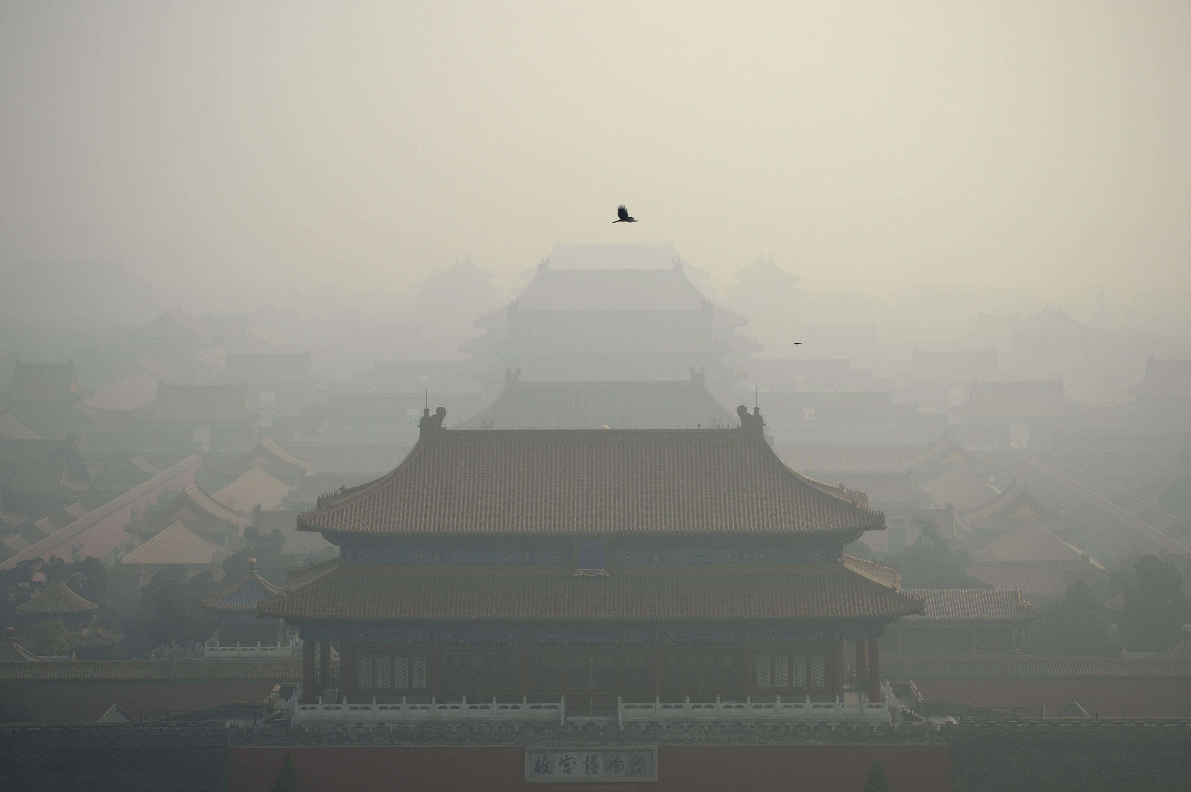 The Forbidden City is shrouded in the heavy air pollution in Beijing in early November. Photo: AFP