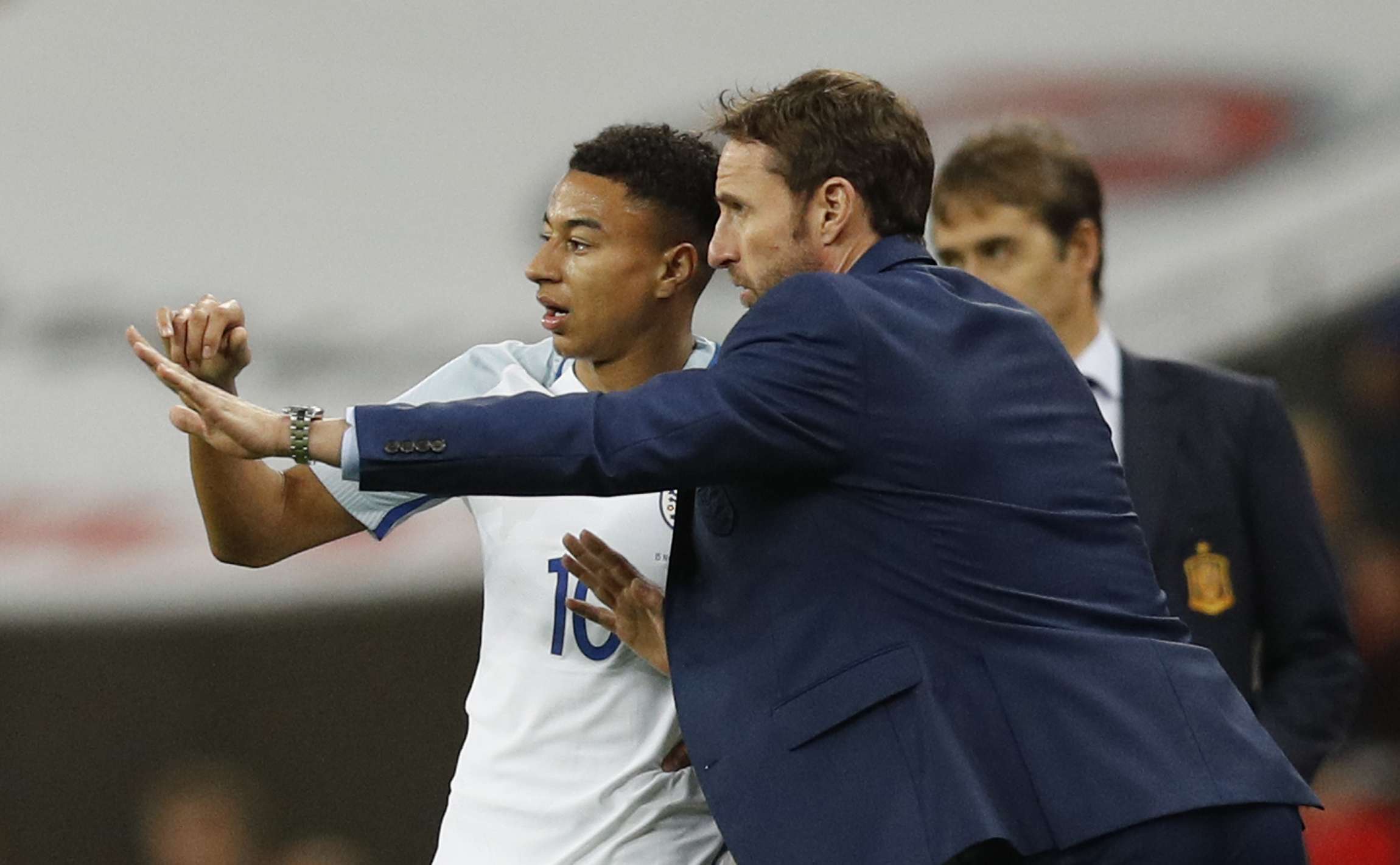 Gareth Southgate (right) with England's Jesse Lingard against Spain. Photo: Reuters