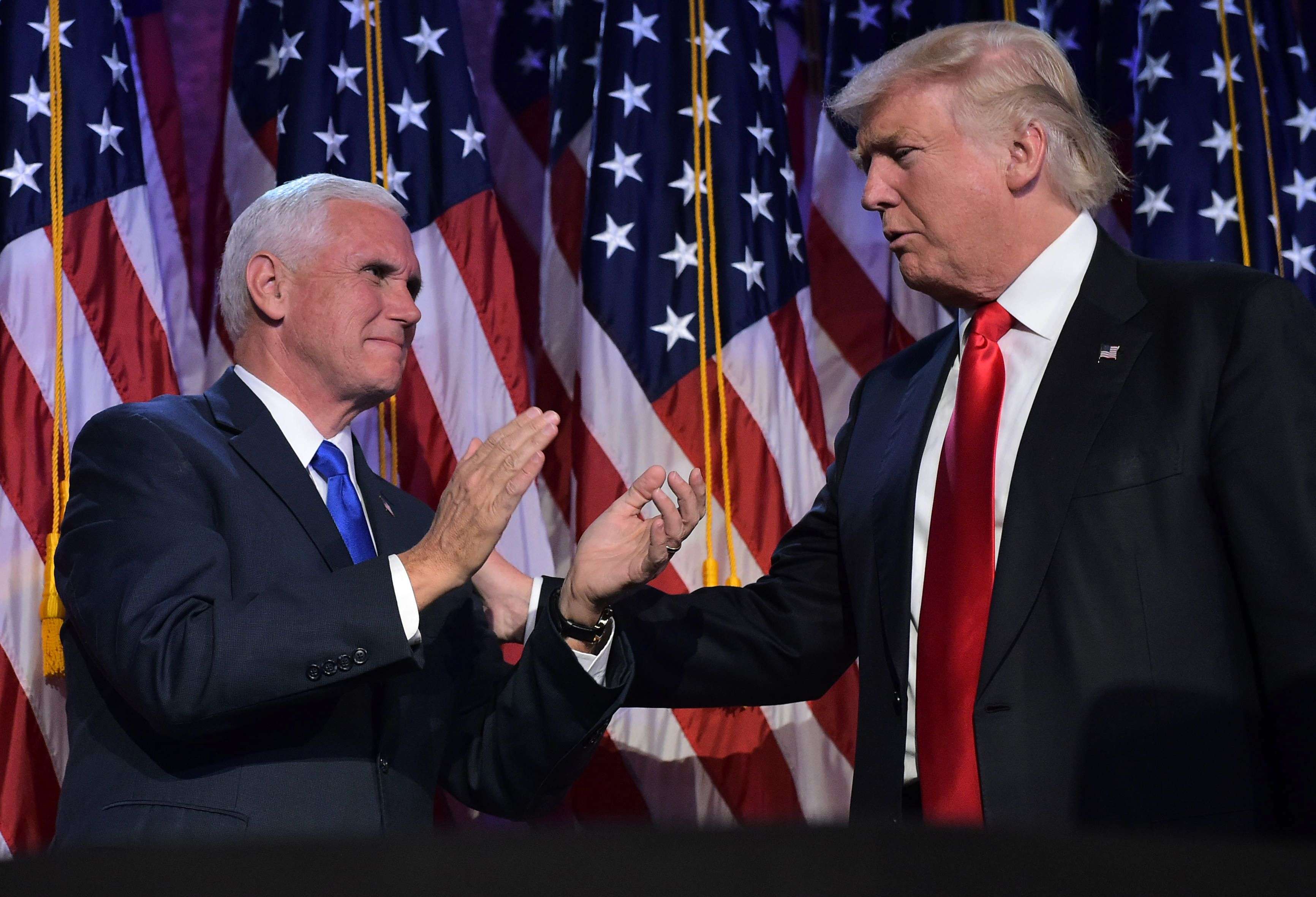 This file photo taken on November 9 shows Republican presidential elect Donald Trump and Vice President elect Mike Pence during election night at the New York Hilton Midtown in New York. Photo: AFP