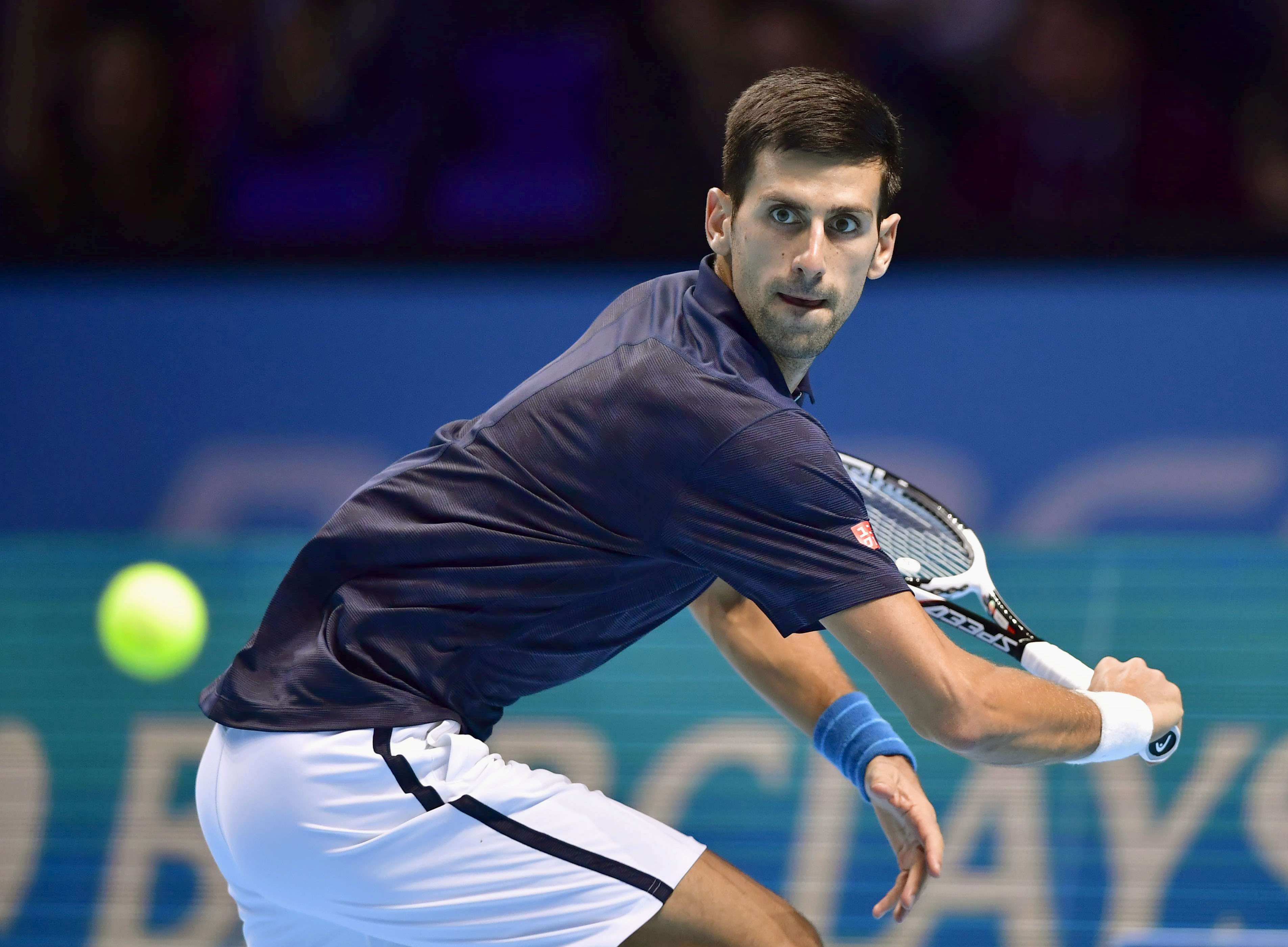 Novak Djokovic prepares to hit a return during his win over Milos Raonic at the ATP World Tour Finals. Photo: Kyodo
