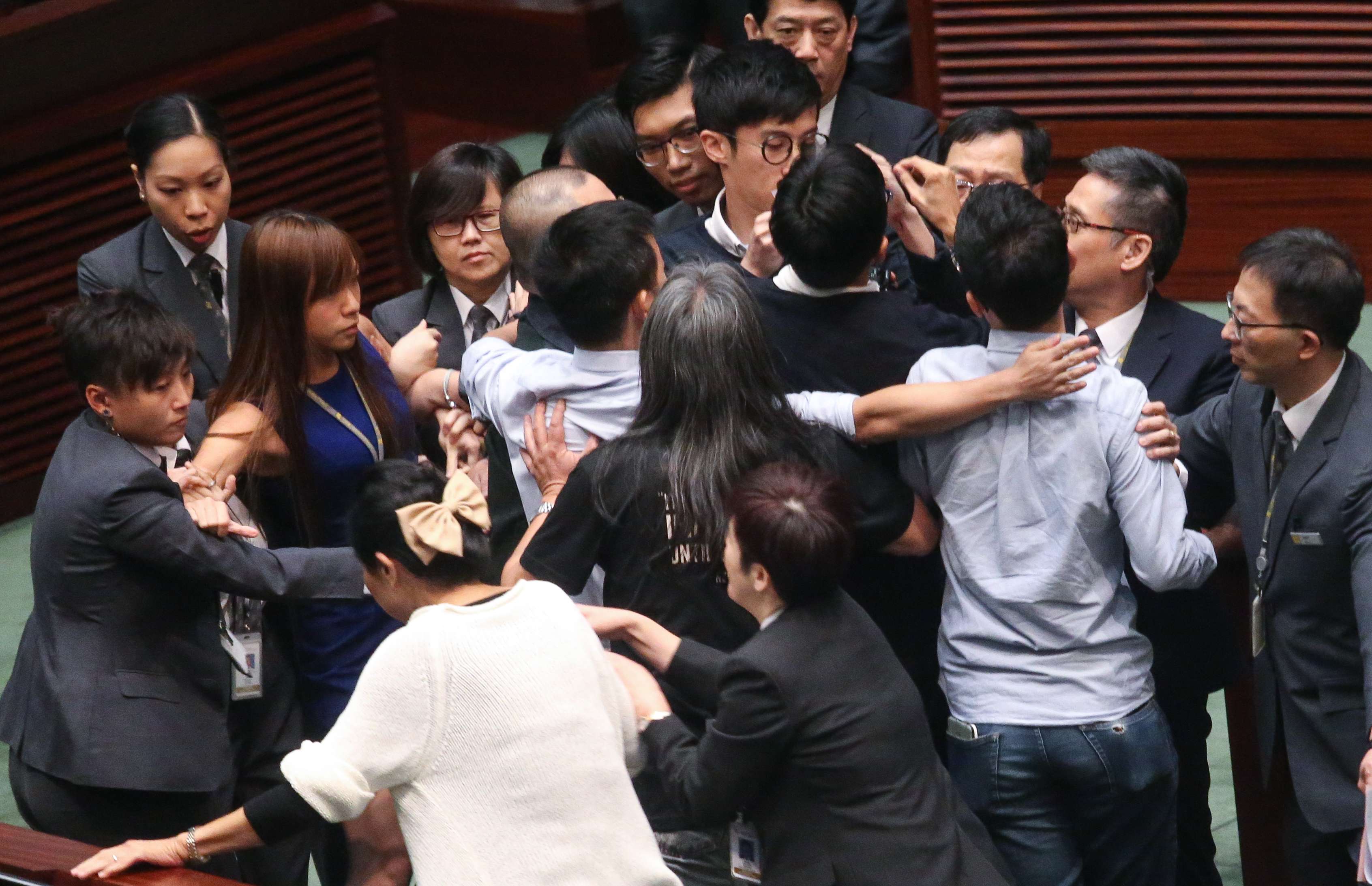 Yau Wai-ching (in a blue dress) and Sixtus Baggio Leung (centre, partially blocked) were stopped from retaking their oaths at a Legislative Council session earlier this month. Photo: K. Y. Cheng