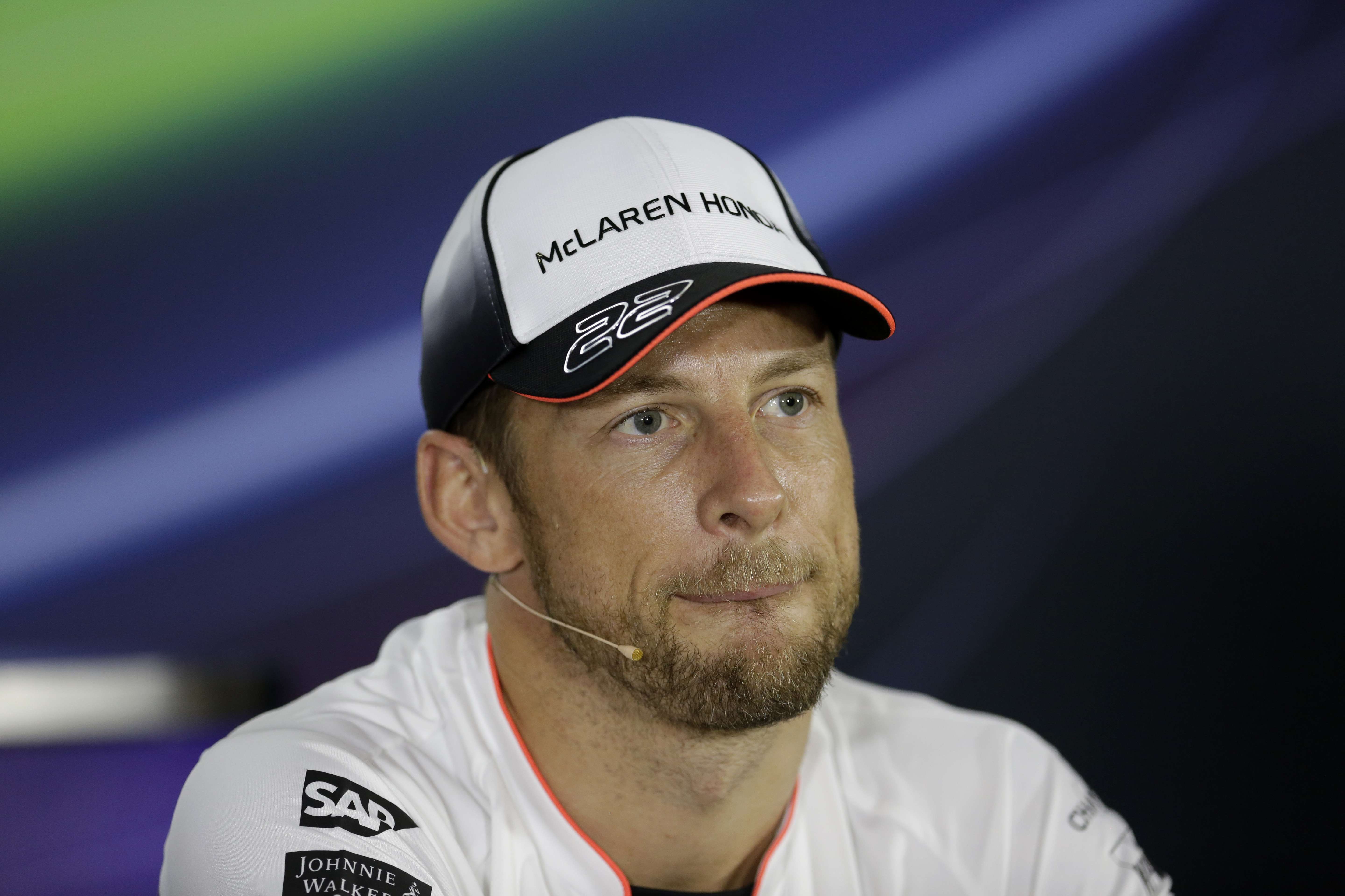 McLaren driver Jenson Button announces his retirement at a press conference in Abu Dhabi on Thursday. Photo: AP