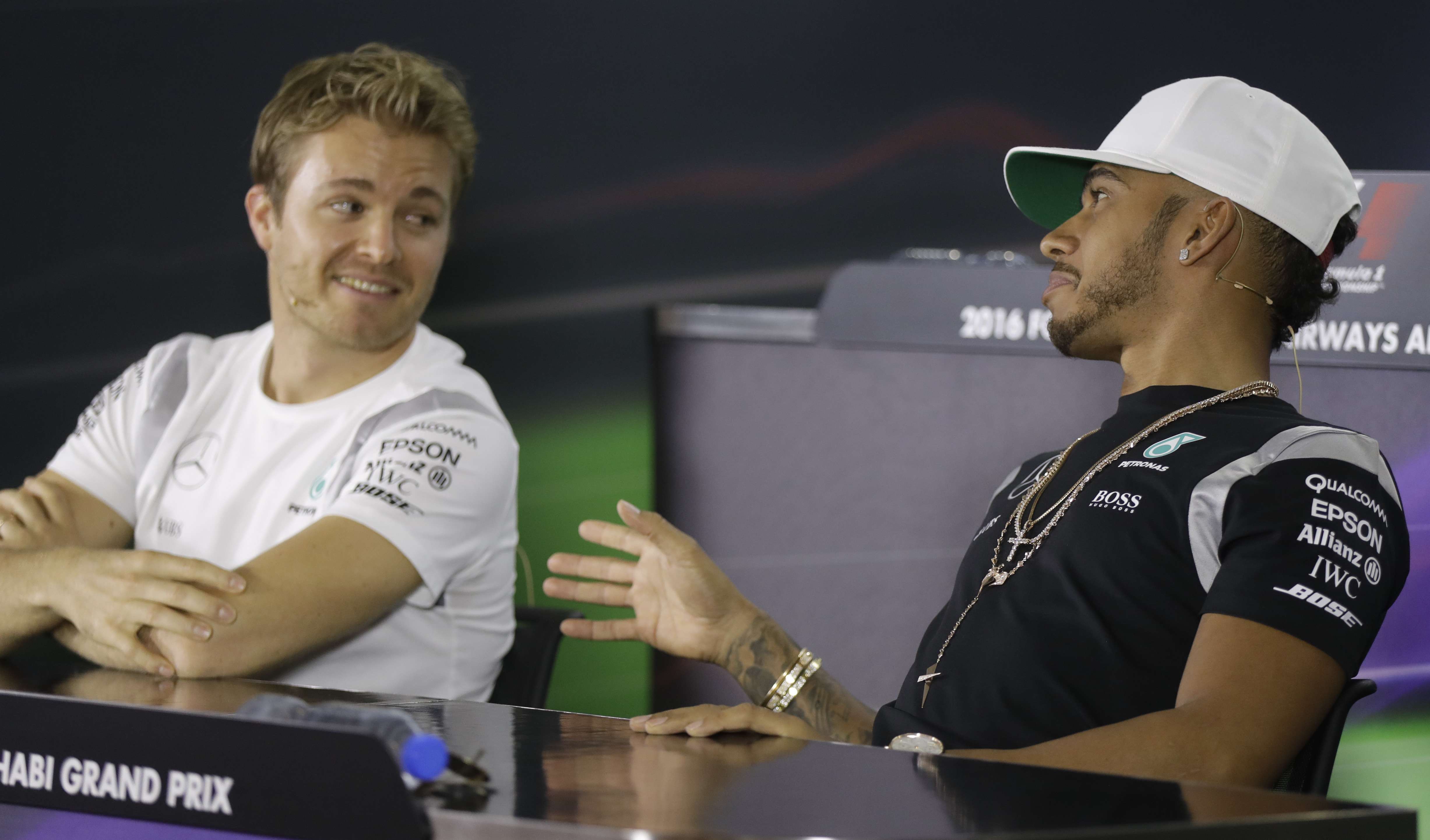 Mercedes drivers Lewis Hamilton and Nico Rosberg discuss the pit crew swap at a press conference ahead of practice for Sunday’s Abu Dhabi Grand Prix. Photo: AP