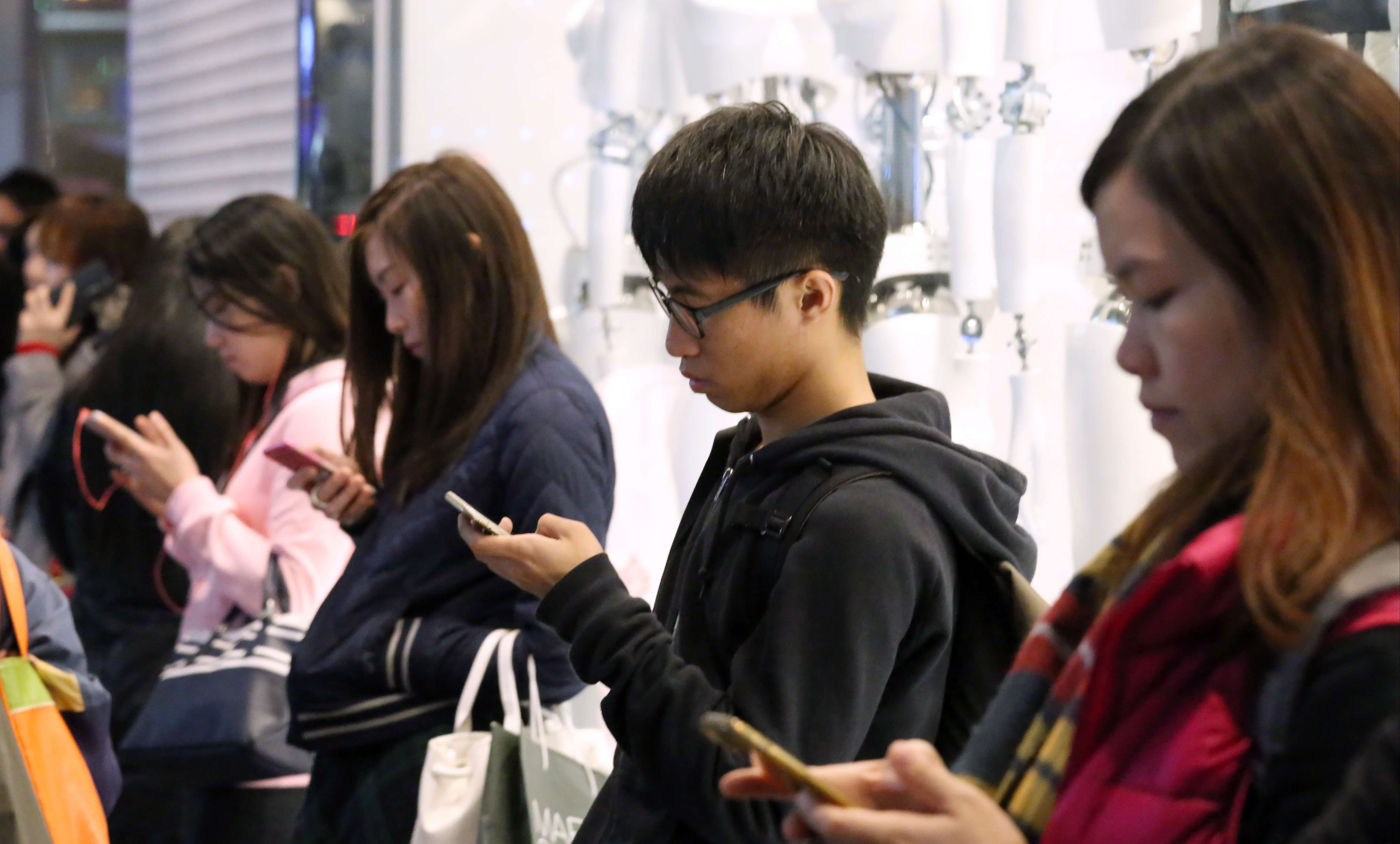 Consumers are charged very low prices for mobile services in Hong Kong but its spectral prices are among the highest in the world. Photo: Nora Tam