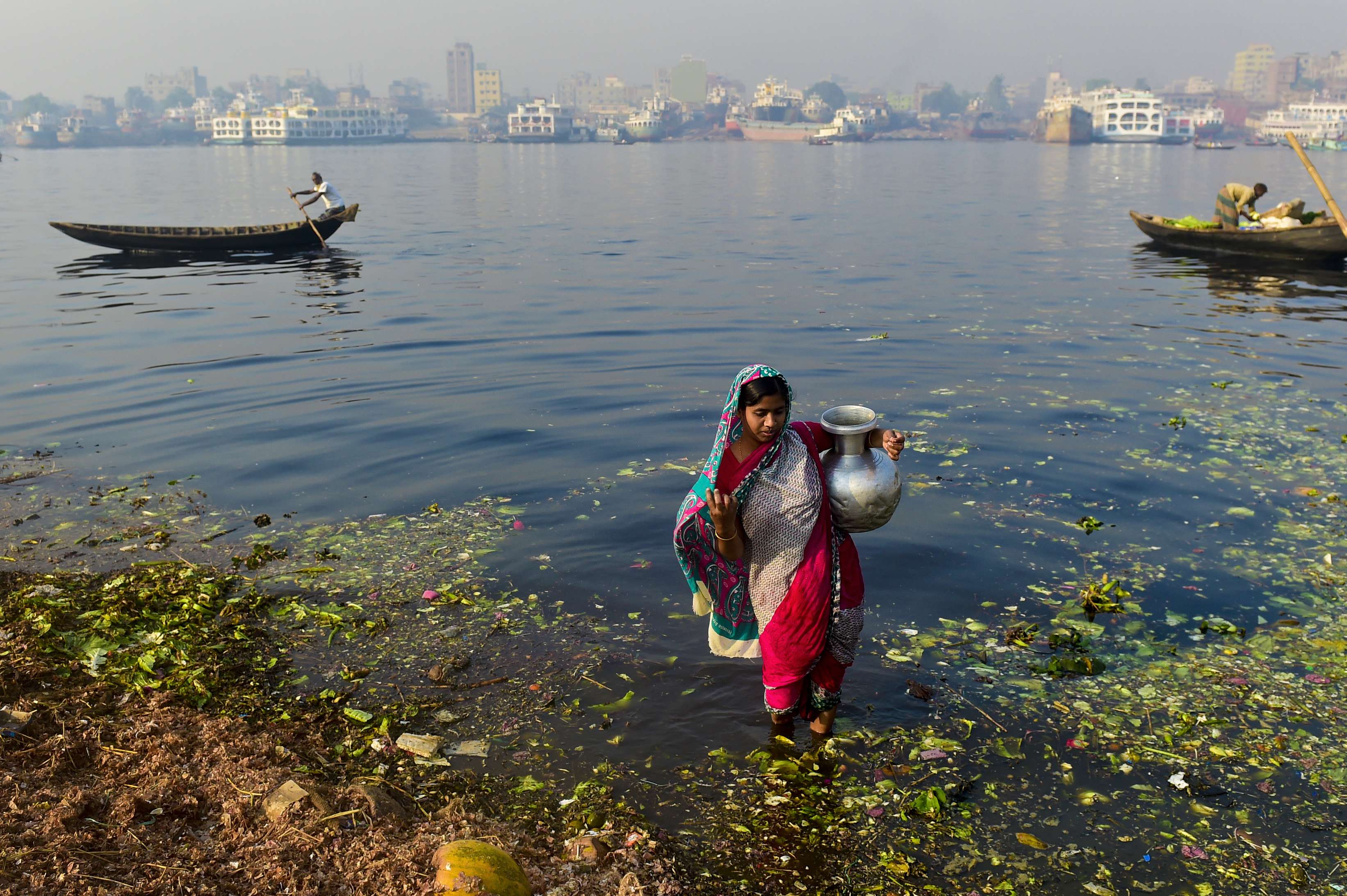 A Bangladeshi woman collects water from a river in Dhaka. The advent of tube wells appeared to have given rural Bangladeshis a source of clean water, but there was a major drawback - arsenic. Photo: AFP