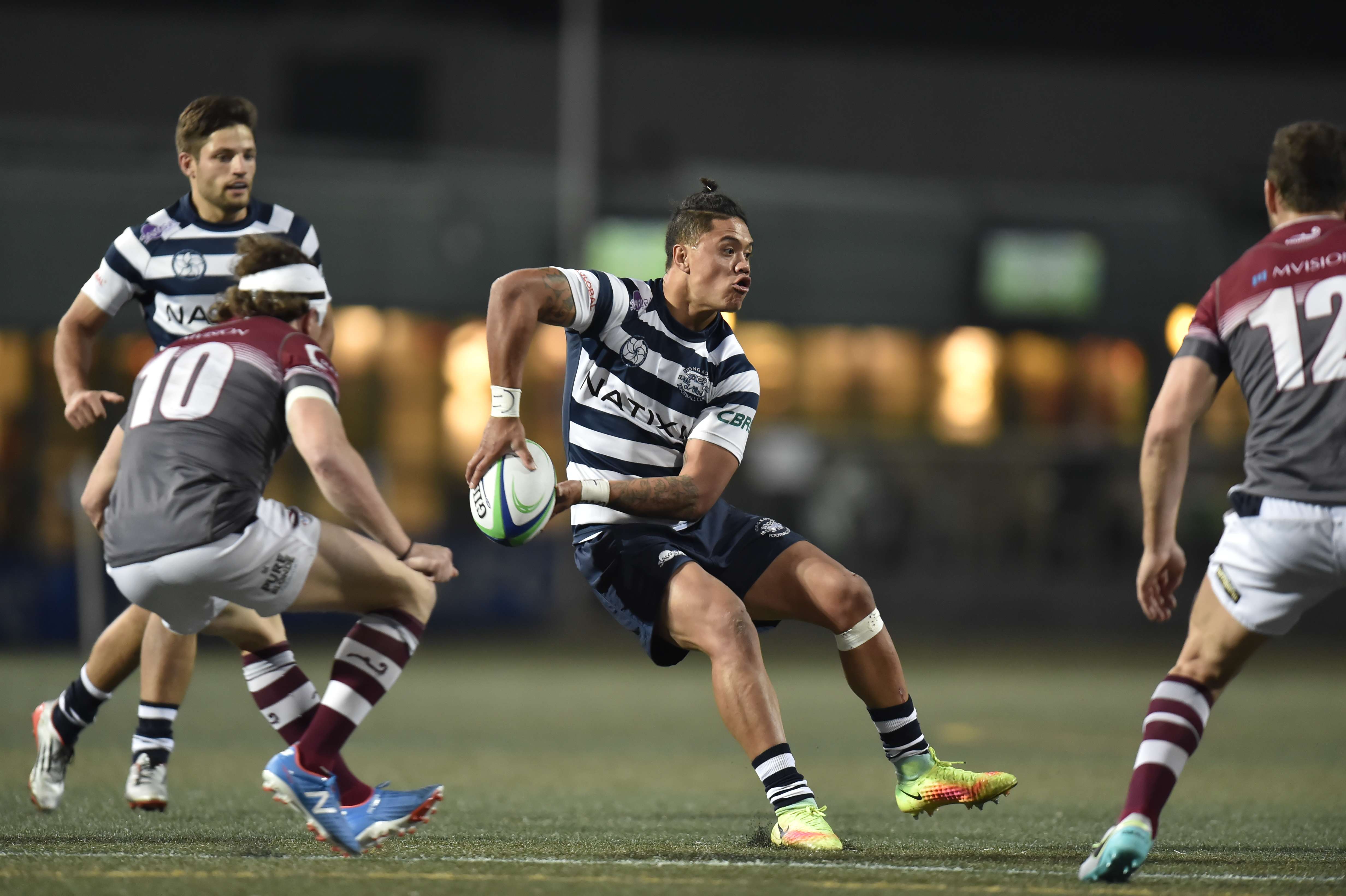 Nathan de Thierry swings a pass for HKFC in their win against Kowloon. Photos: Hong Kong Rugby Union