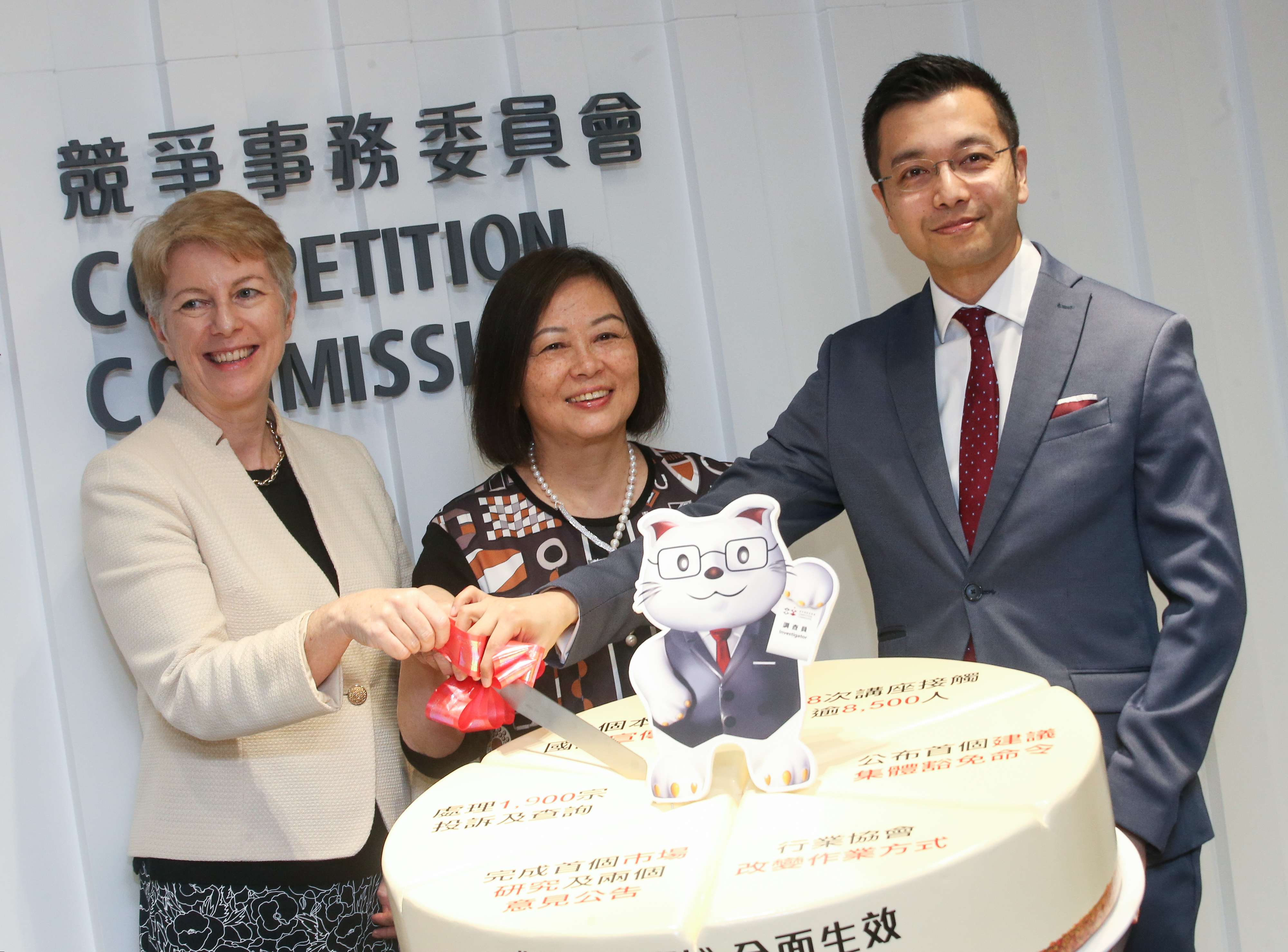 Rose Webb, Anna Wu and commission senior executive director Rasul Butt celebrate the first anniversary of the Competition Ordinance coming into full effect. Photo: David Wong
