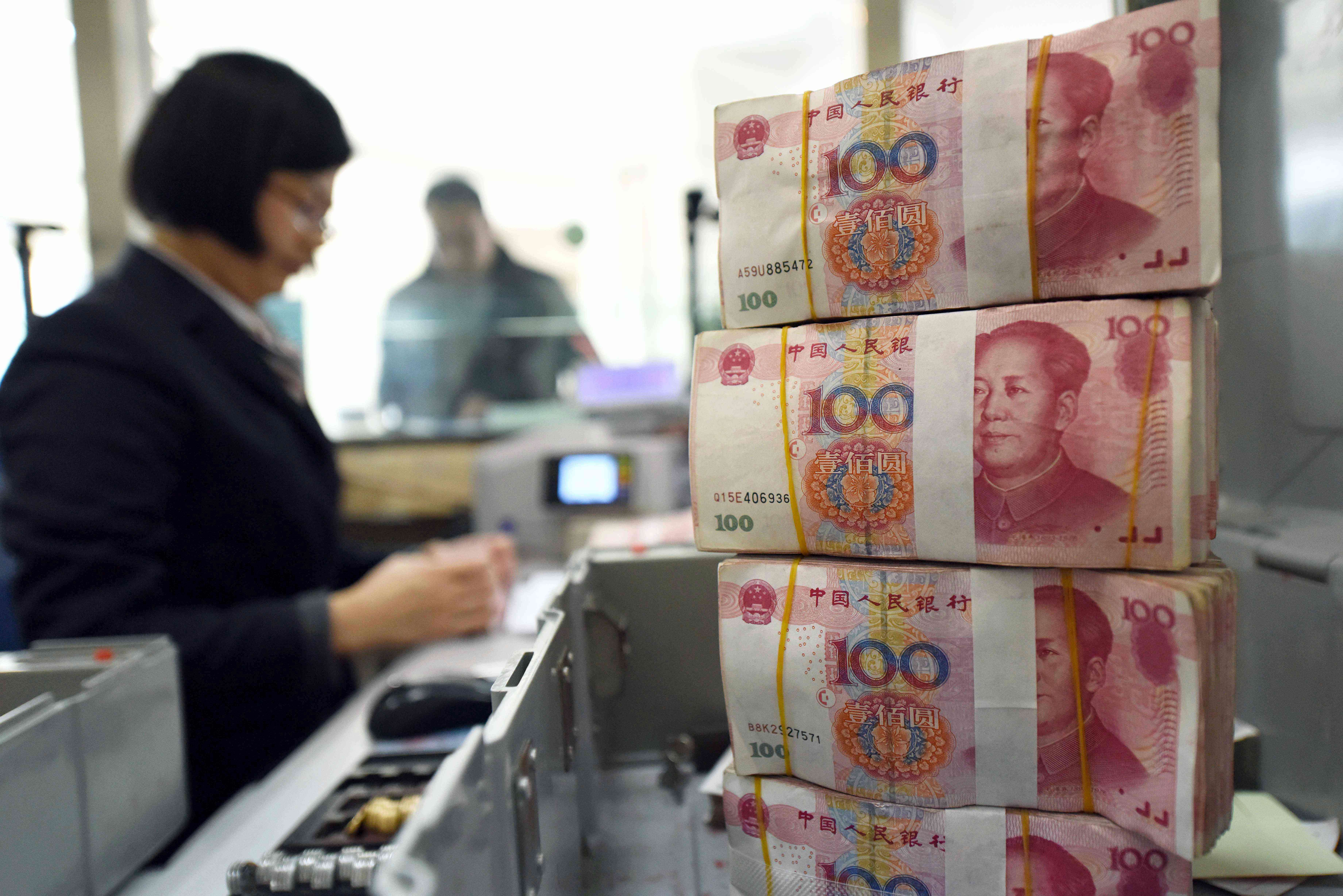 The yuan is still inching closer to 7 per US dollar, quoted at 6.9493 and 6.9758 in the onshore and offshore markets, respectively, on Friday – the lowest levels in eight and a half years. Photo: AFP