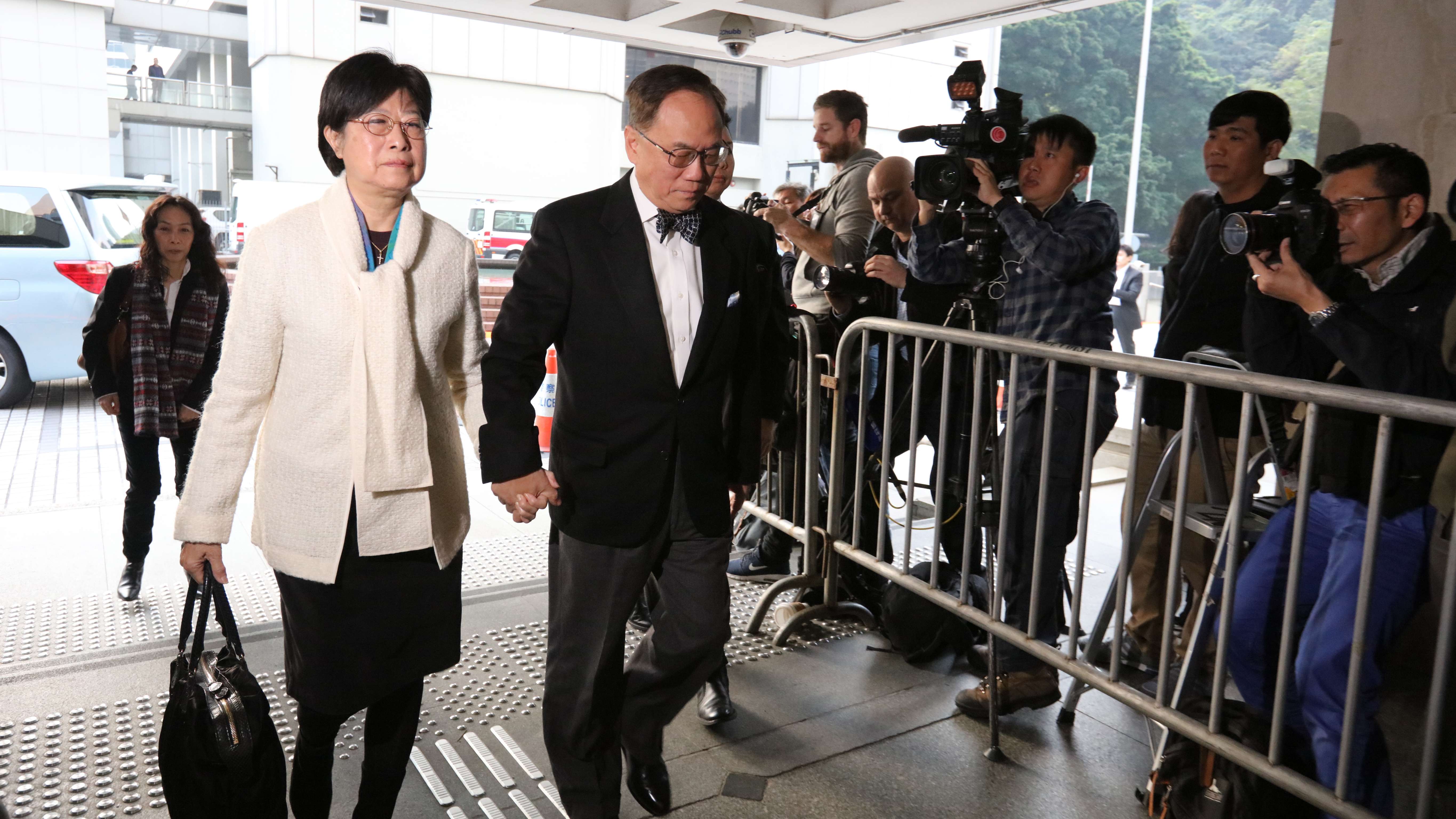 Former chief executive Donald Tsang accompanied by his wife Selina Tsang outside the High Court this morning. Photo: Felix Wong