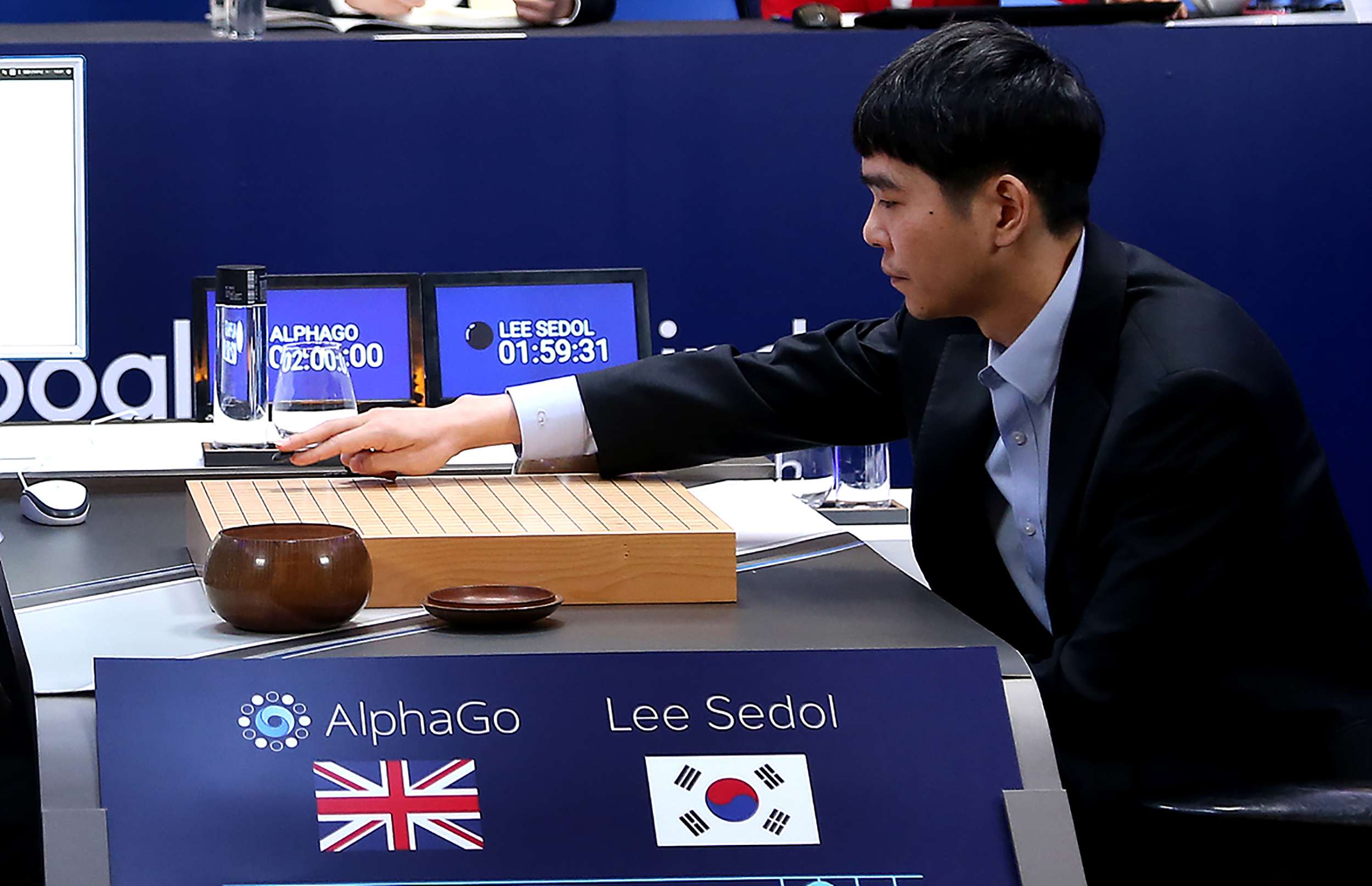 Lee Sedol, one of the greatest modern players of Go, makes a move during the Google DeepMind Challenge Match against Google-developed supercomputer AlphaGo on March 12, 2016. Photo: AFP