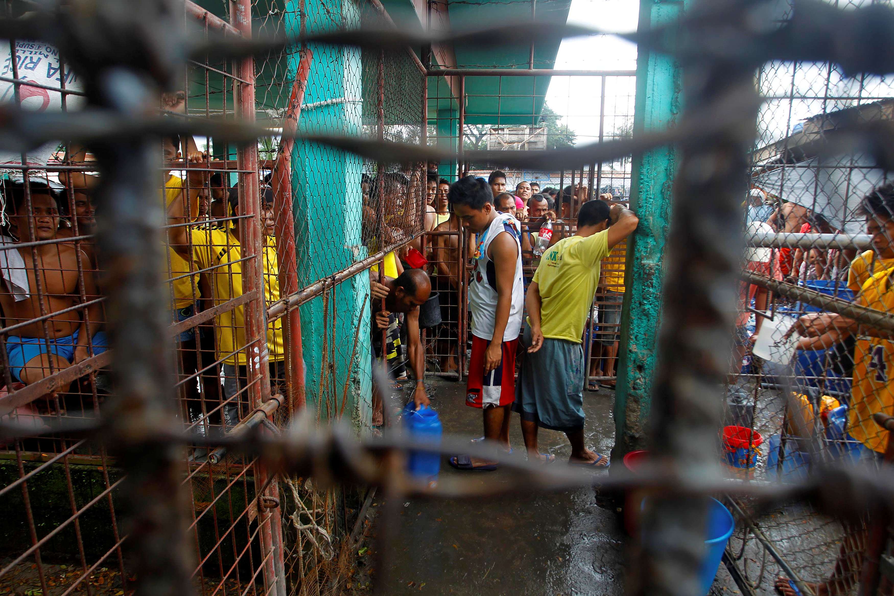 Inmates gather inside the Kidapawan prison following the escape of more than 150 inmates. Photo: Reuters