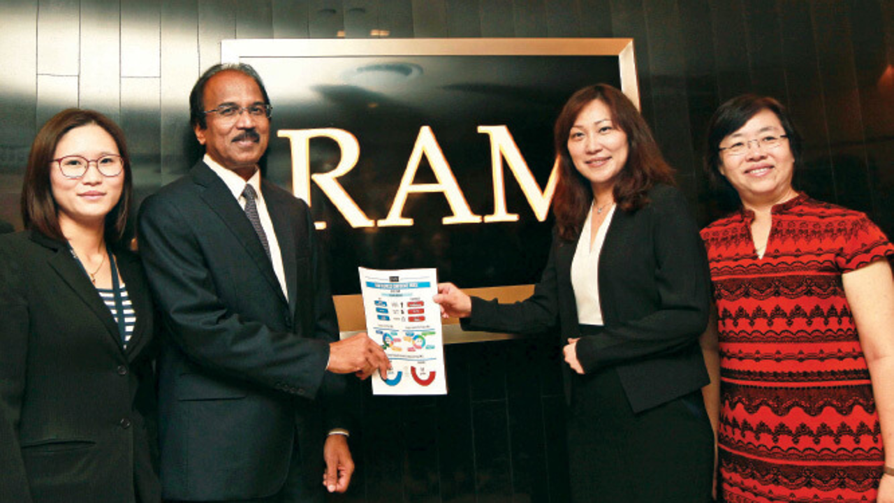 (From left) Fong, Govindan, RAM Credit Information CEO Dawn Lai and RAM Credit Information director Chen Yew Nah at the launch of the RAM Business Confidence Index yesterday. Photo: Haris Hassan/The Edge