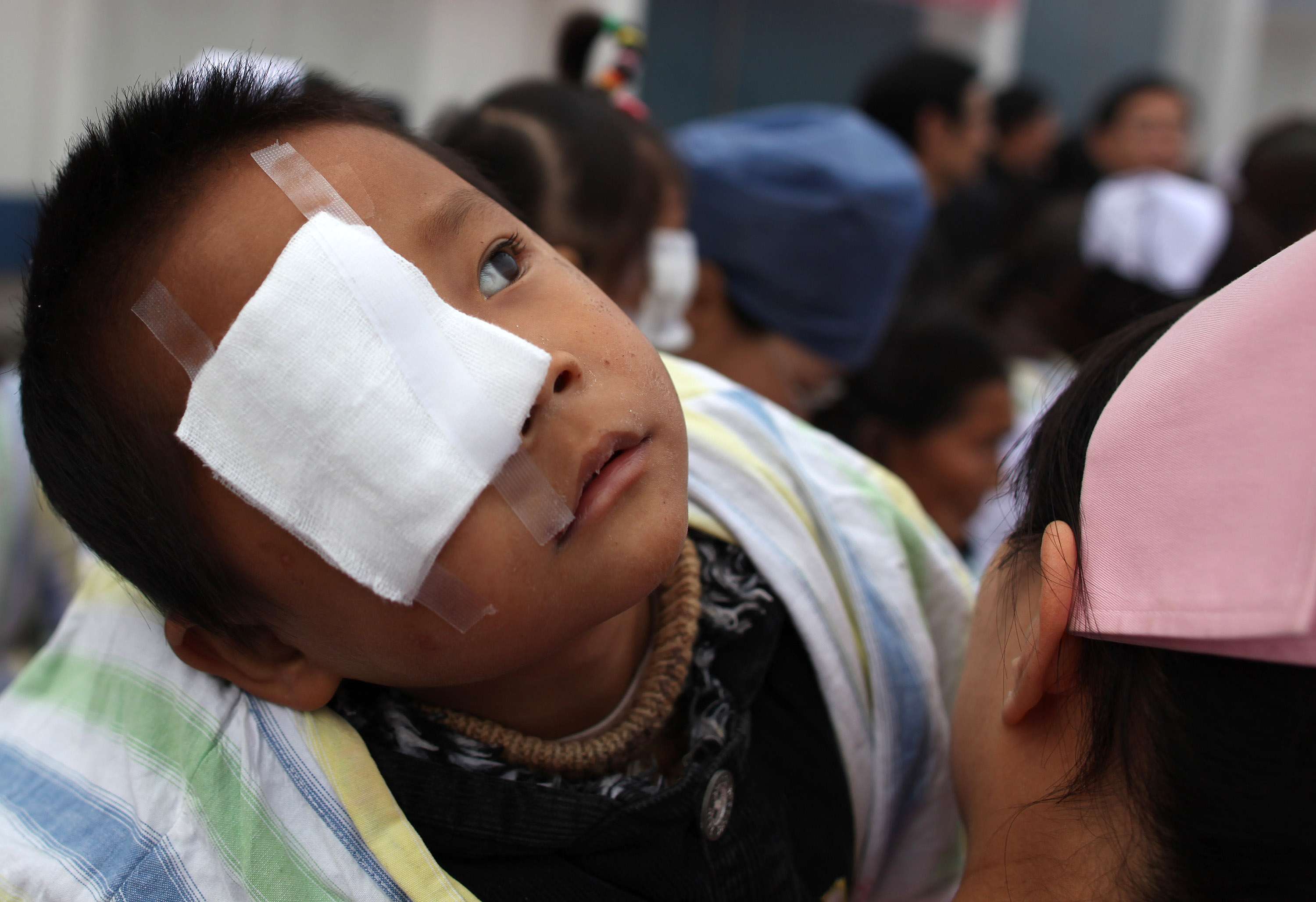 A nurse tends to a boy who has undergone cataract surgery in a hospital in Suining in Sichuan Province. Private hospitals, especially those focusing on conditions considered as “minor specialities”, such as eye diseases, are predicted to enjoy strong profit growth in the next few years, according to fresh research. . Photo: Getty Images