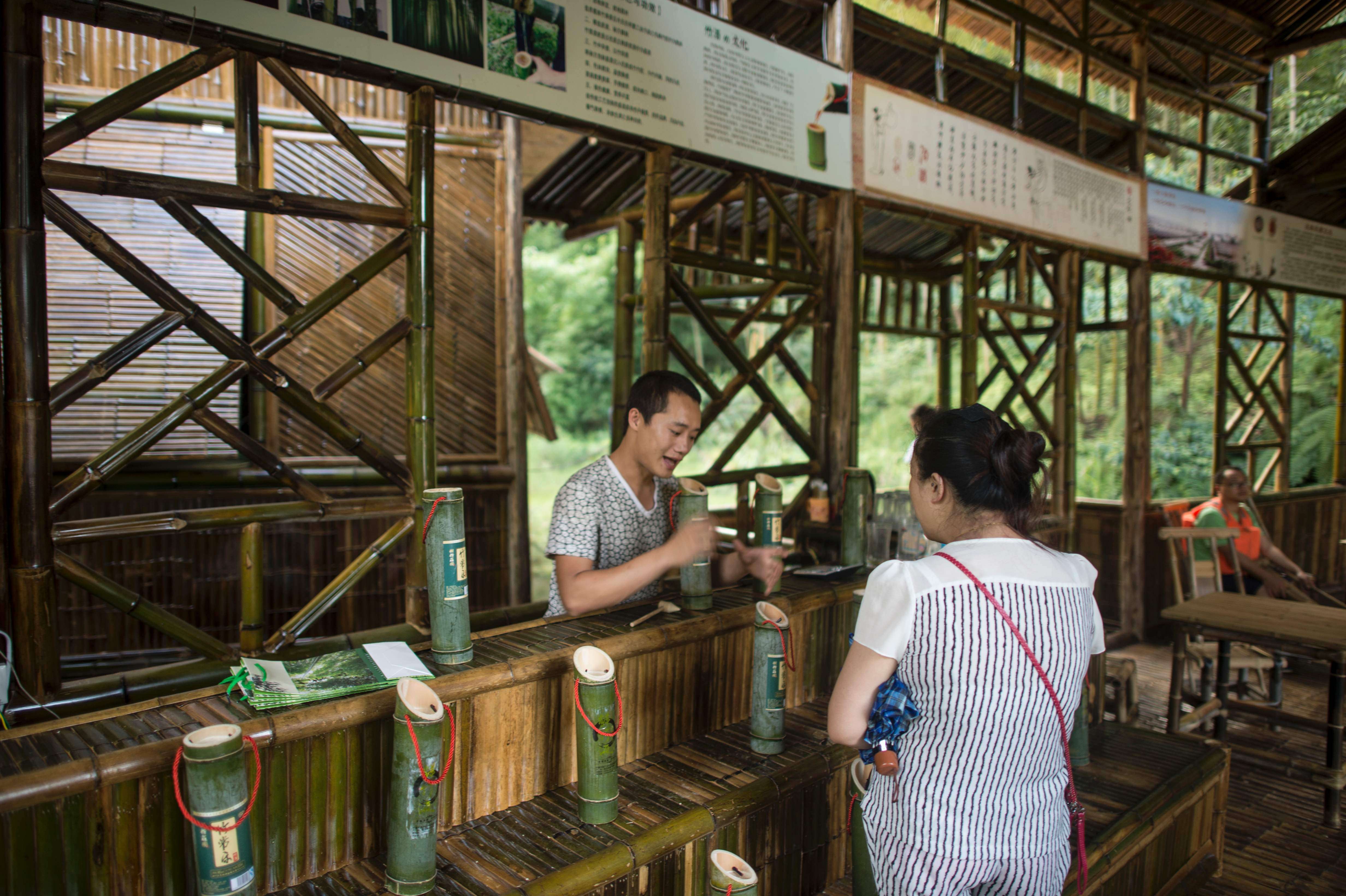 Chinese villagers leave liquor to purify inside bamboo to make alcohol