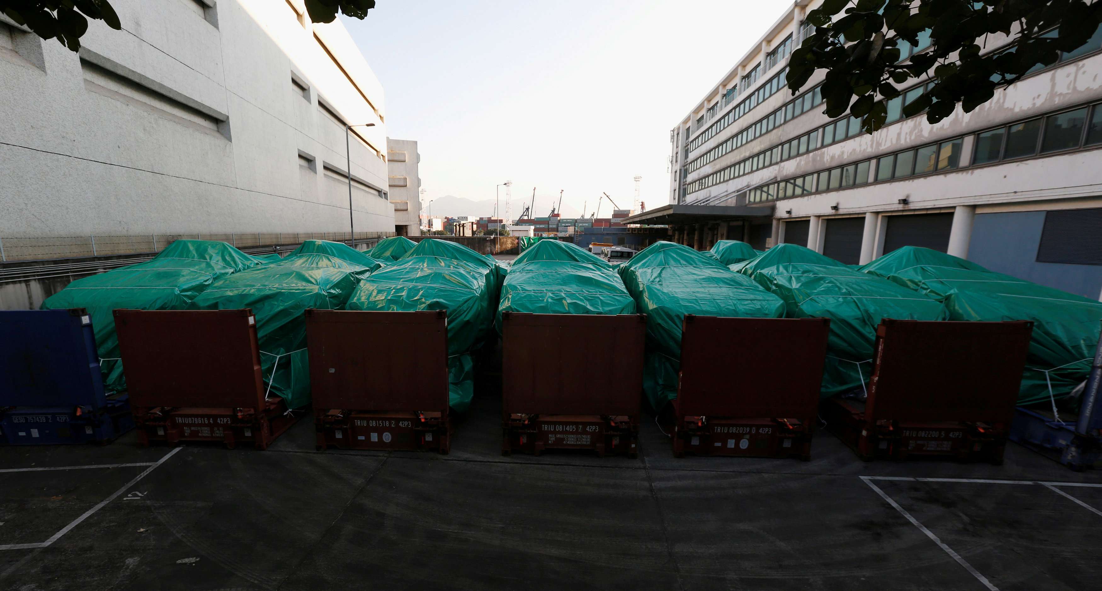 A file picture taken in November of the Singapore armoured troop carriers covered at a cargo terminal in Hong Kong. Photo: Reuters