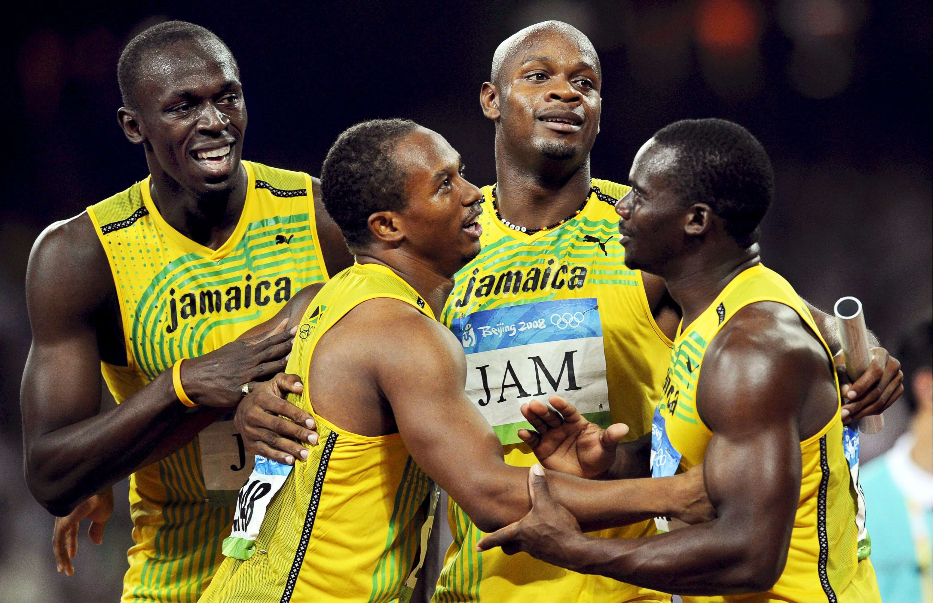 Usain Bolt (left), Michael Frater, Asafa Powell and Nesta Carter celebrating after winning the 4x100m relay final at the Beijing 2008 Olympic Games. Photo: EPA