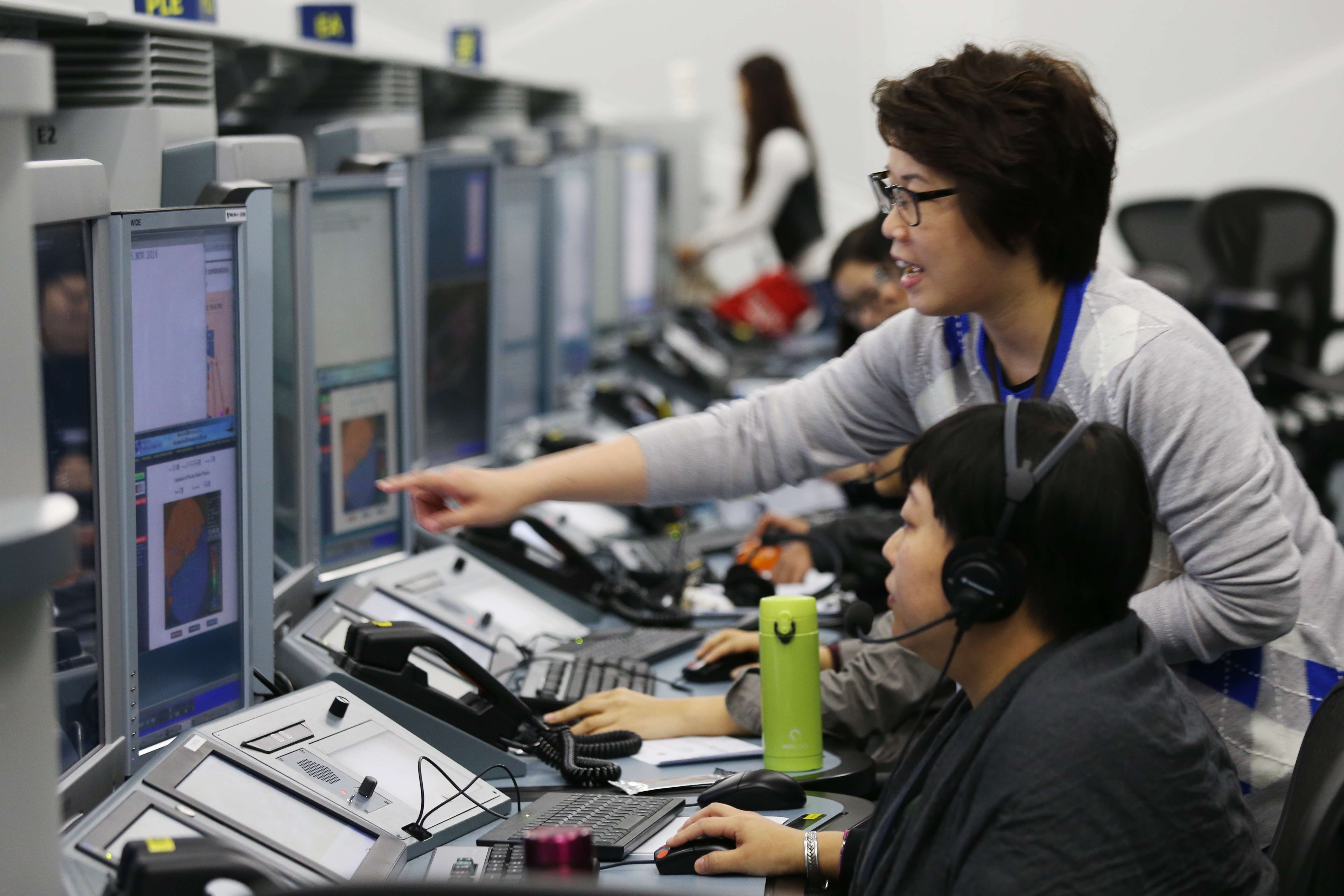 Air traffic controllers using the new system. Photo: Dickson Lee