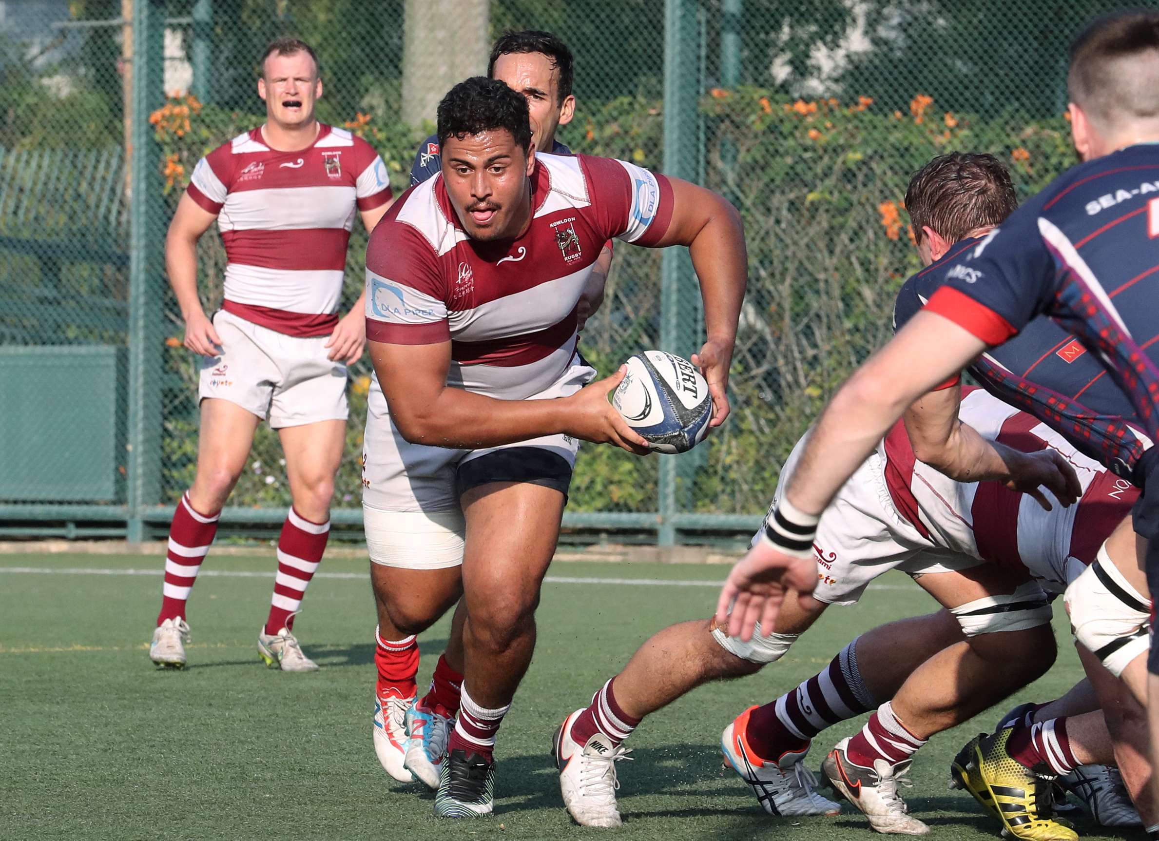Kowloon’s Turoa Stephens launches one of his trademark carries against Scottish in the Hong Kong Premiership on Saturday. Photo: Edward Wong