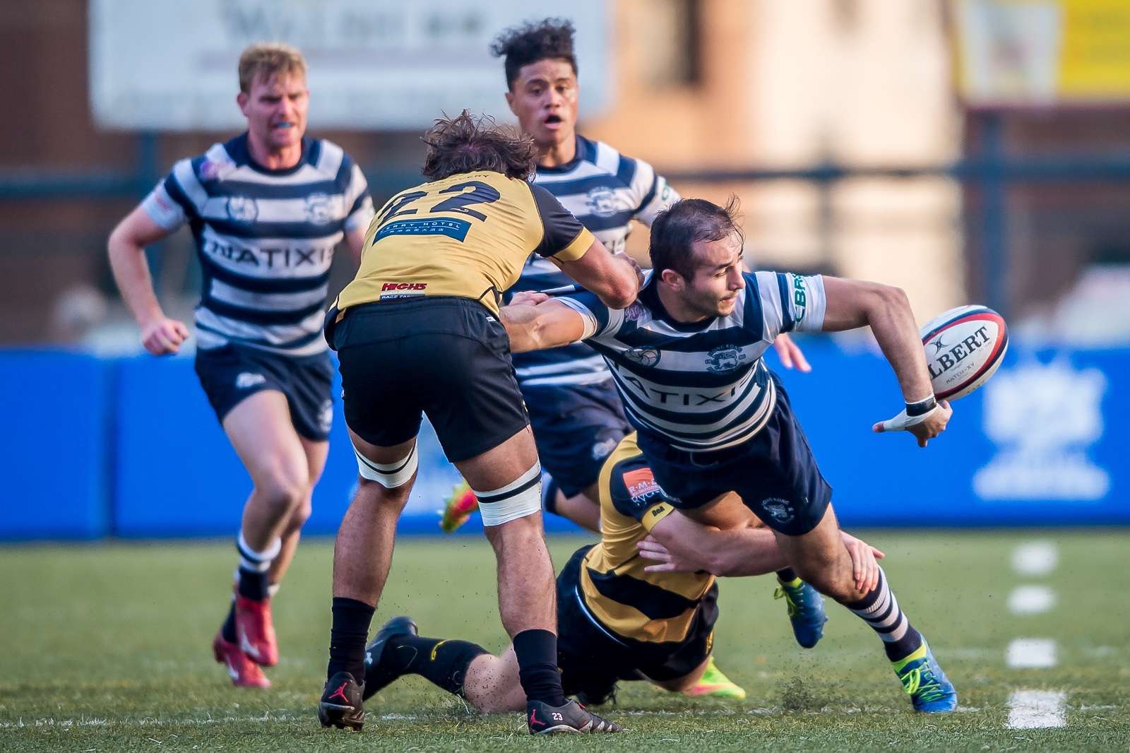 Football Club winger Seb Alfonsi offloads in the tackle against Tigers in the Hong Kong Premiership. Photo: HKRU